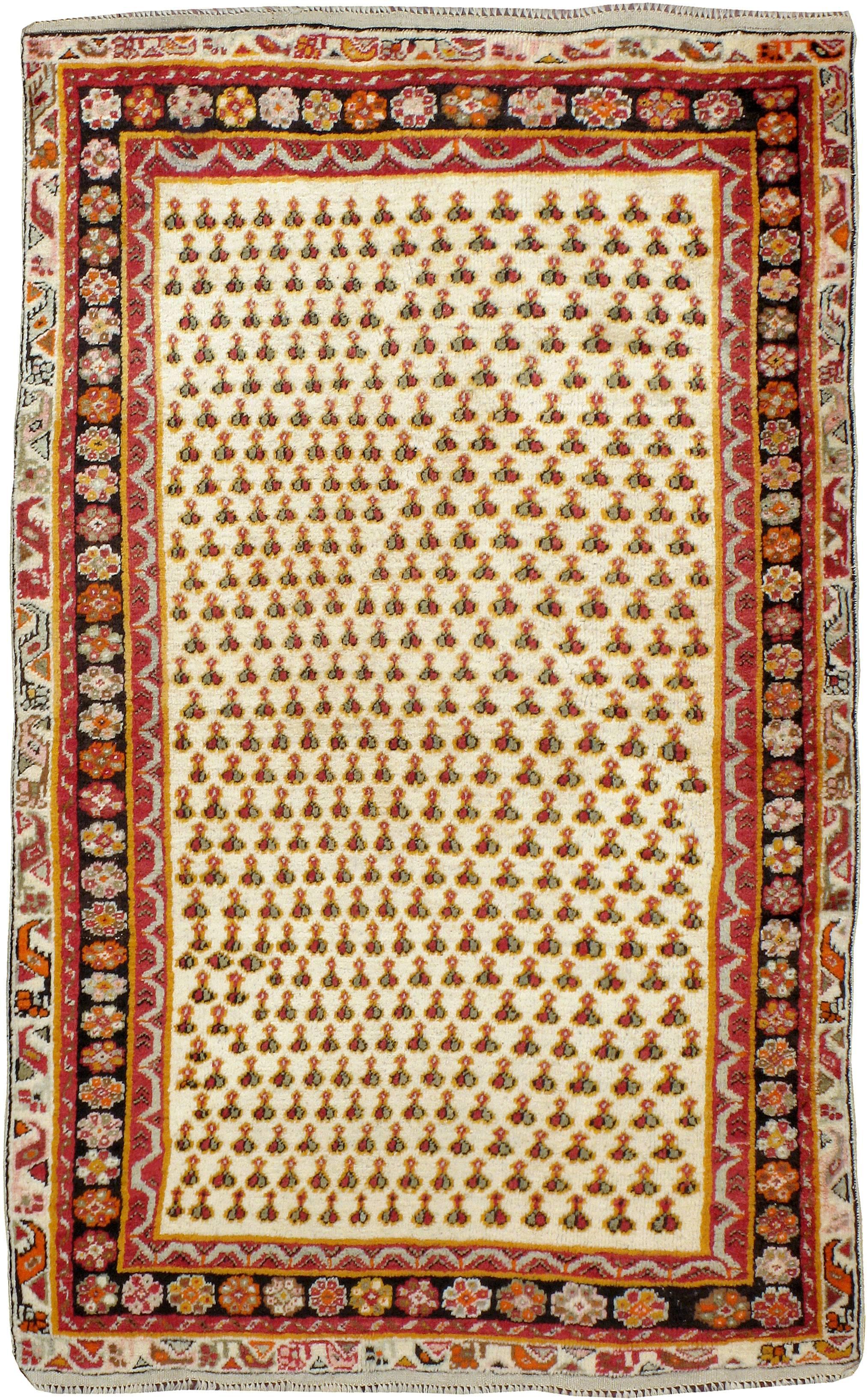 An antique Turkish Ghiordes (also spelled Ghourdes) carpet from the first quarter of the 20th century.