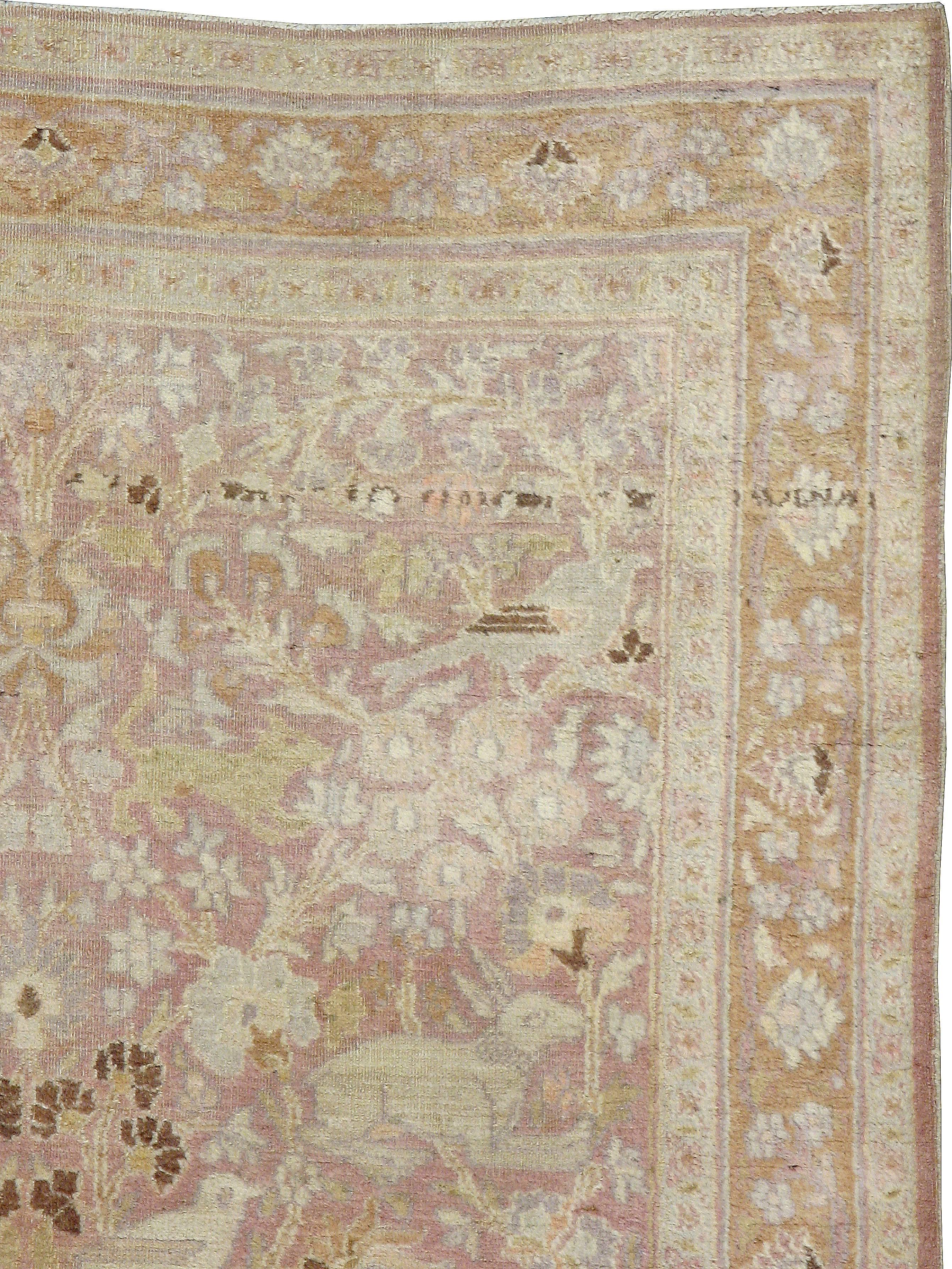 An antique Persian Khorassan carpet from the turn of the 20th century with a pictorial hunting ground motif.