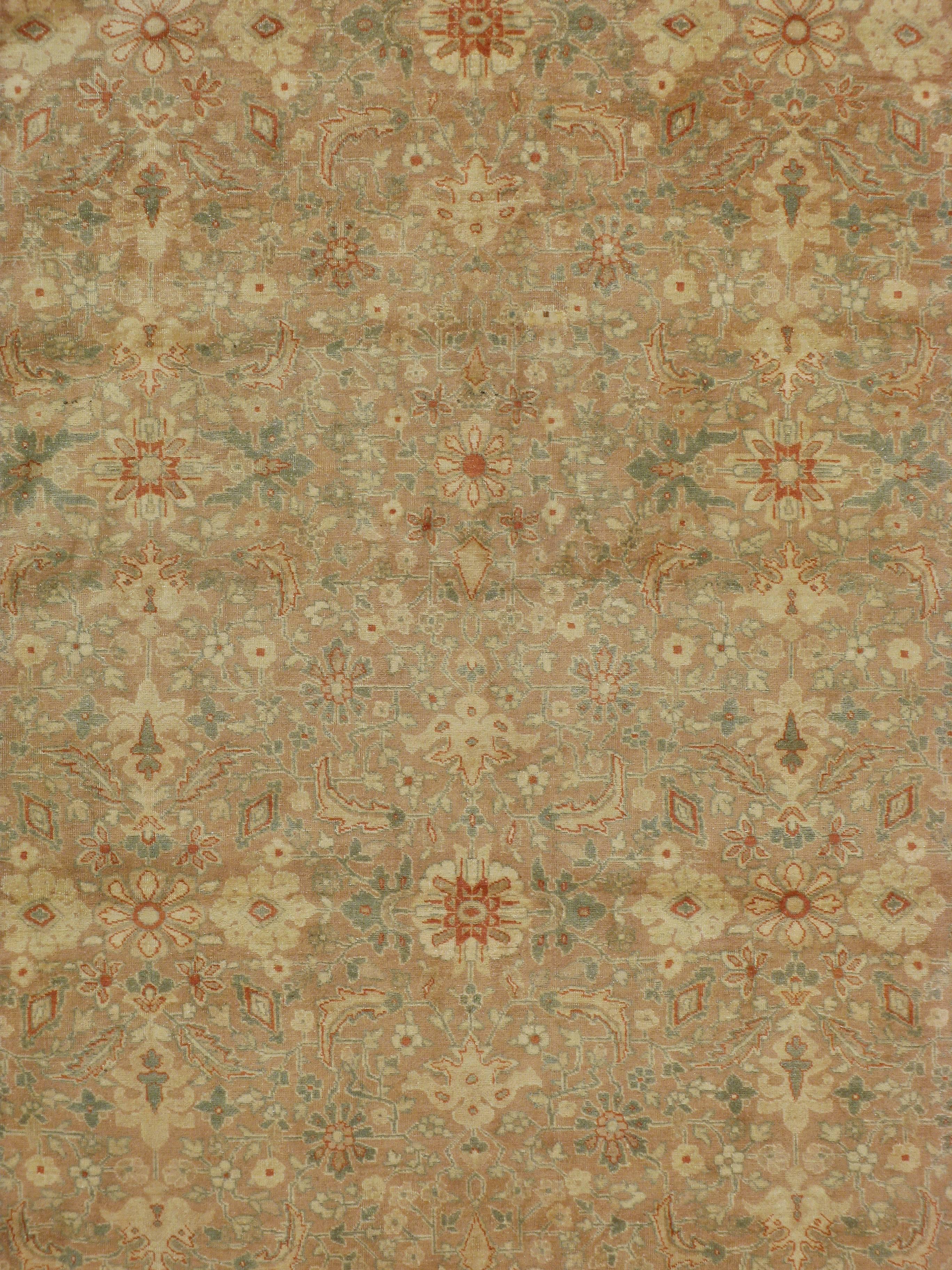 An early 20th century Persian Tabriz carpet.