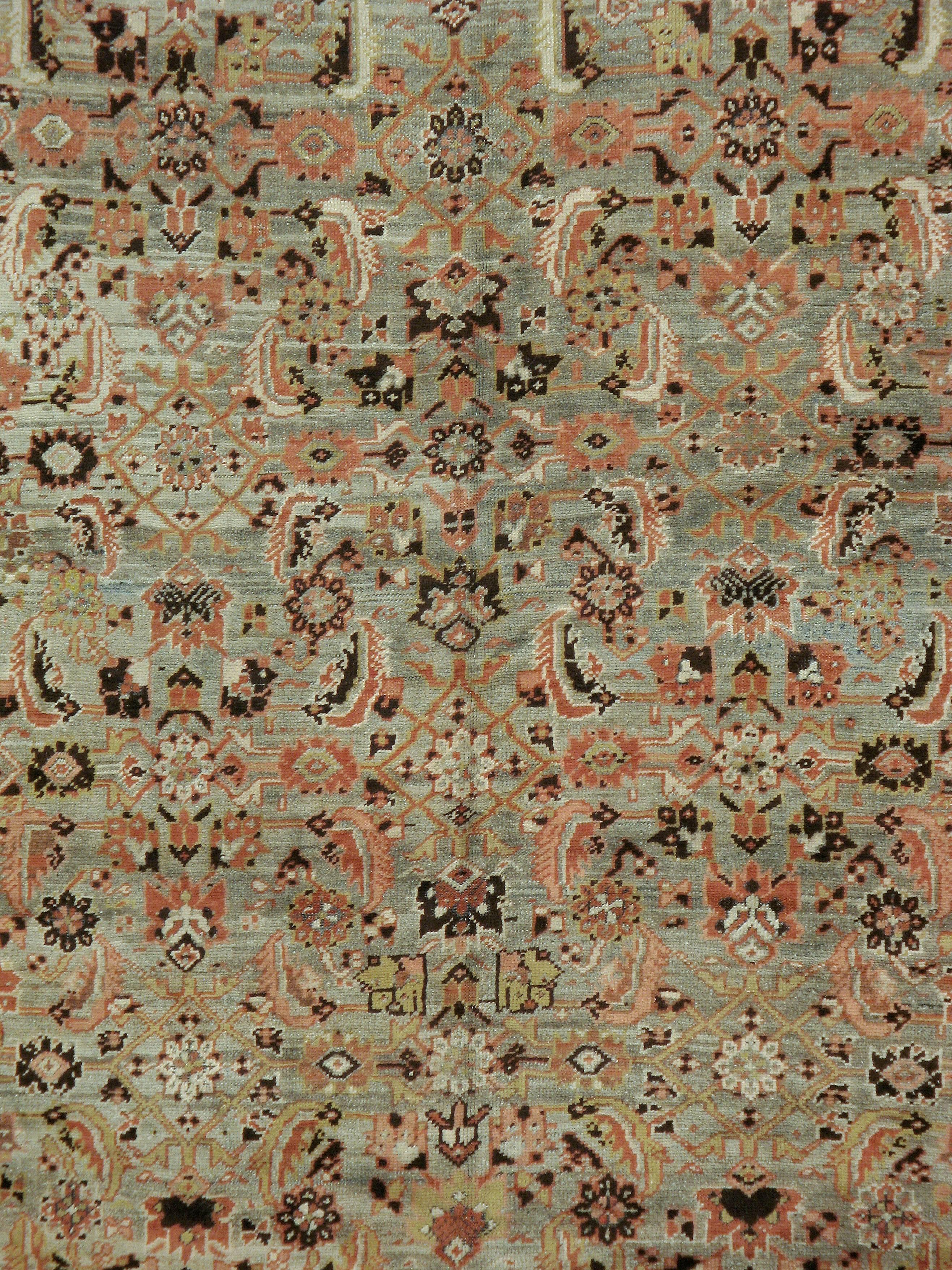 An antique washed Russian Karabagh carpet from the first quarter of the 20th century.