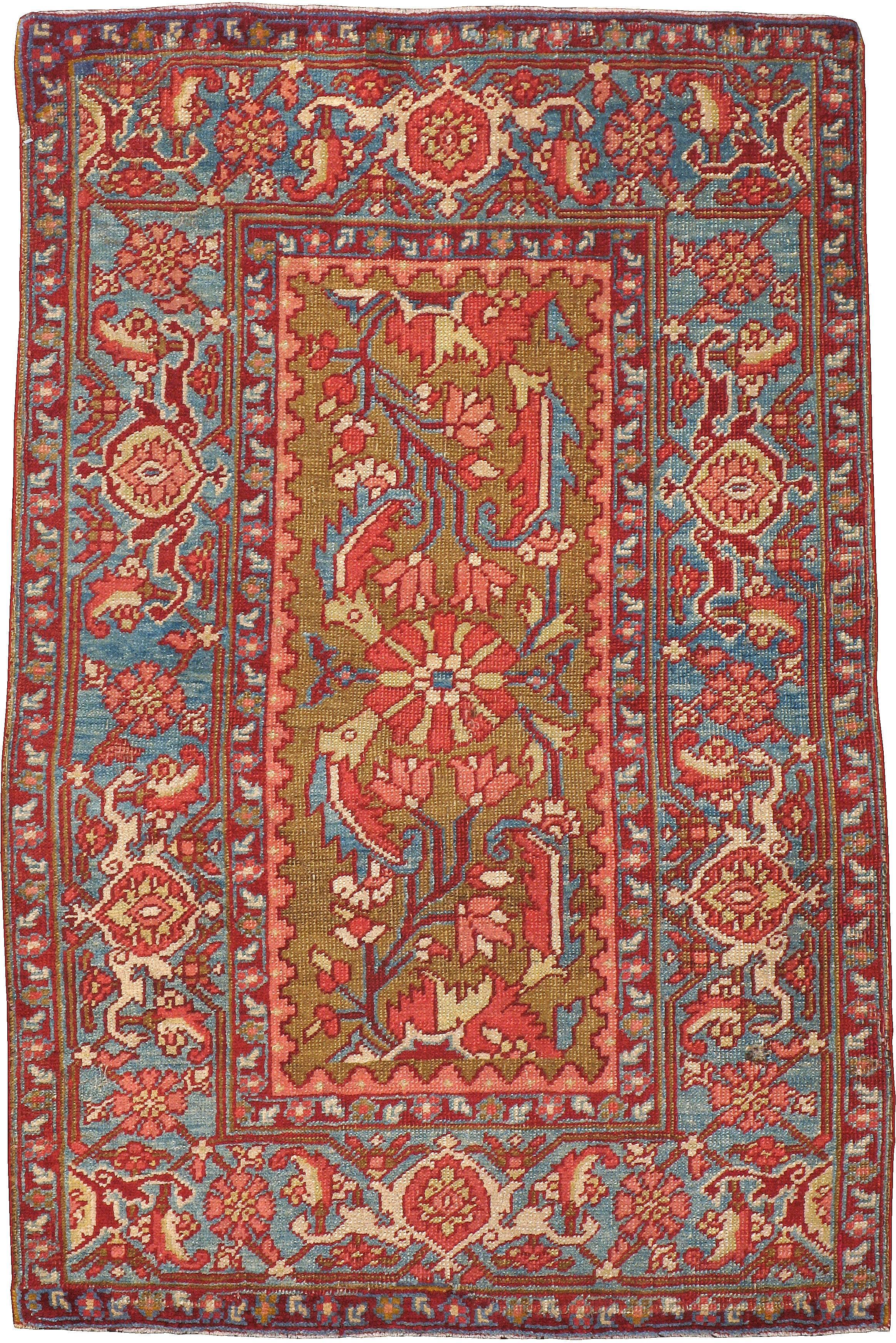 An antique Persian Heriz carpet from the first quarter of the 20th century.