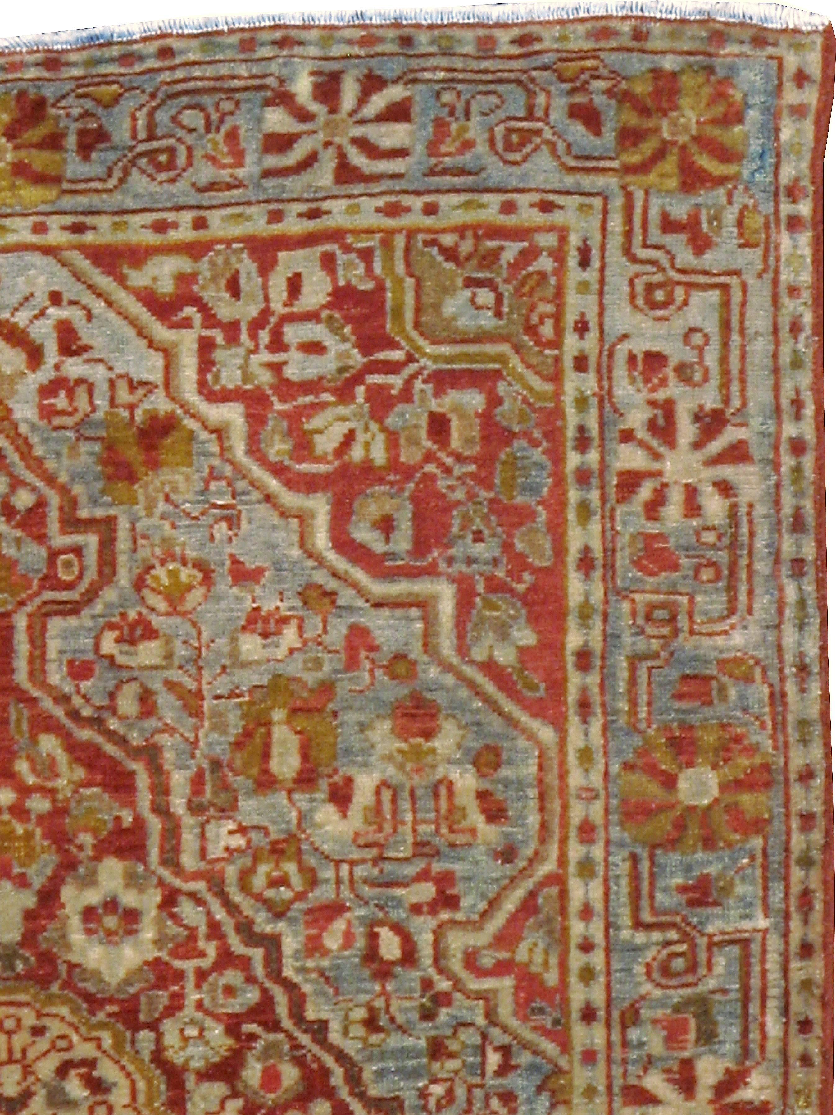 An antique Persian Sarouk Farahan carpet from the first quarter of the 20th century.