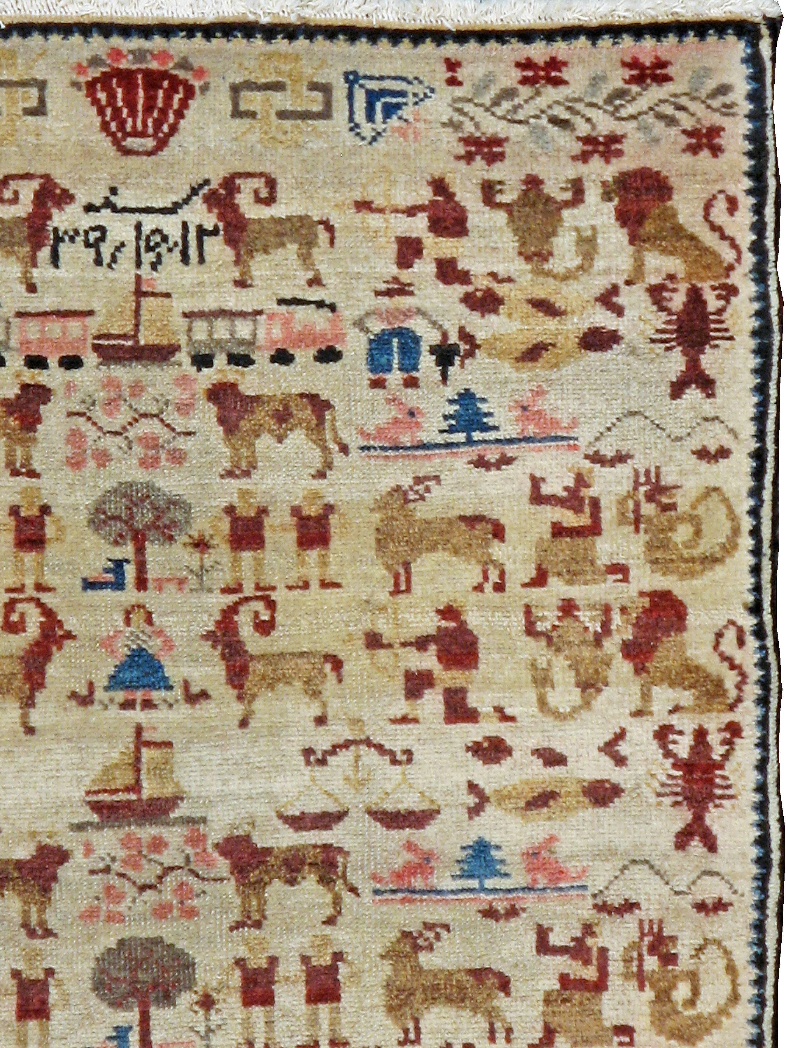 A vintage Persian Hamadan pictorial rug from the second quarter of the 20th century.