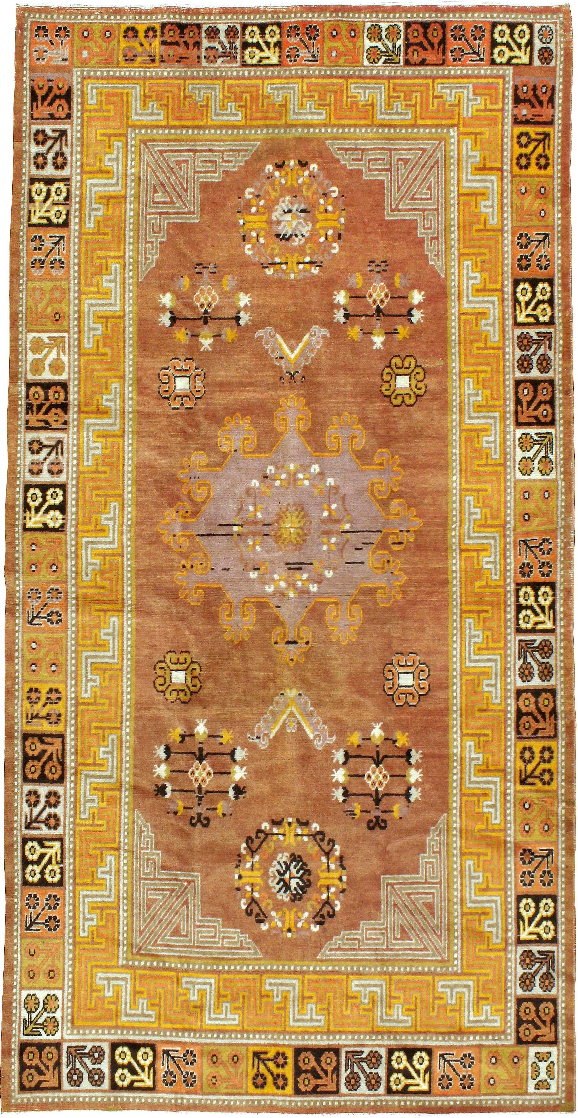An antique East Turkestan Khotan carpet from the first quarter of the 20th century. Antique Khotan rugs and carpets were produced in the oasis town of Eastern Turkestan, today part of the Xinjiang region in Western China. This area has had a steady