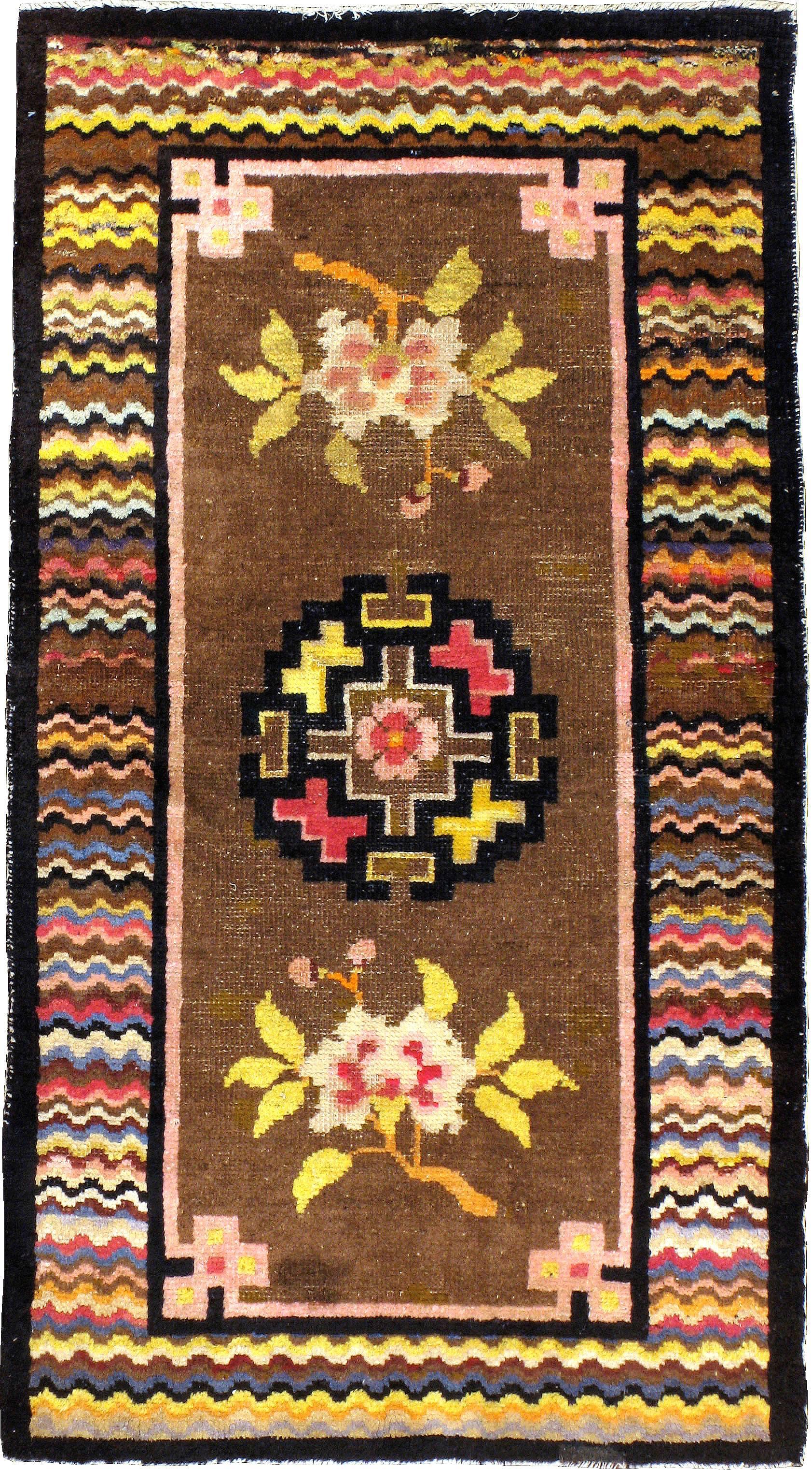 An antique Turkestan Khotan style carpet from the second quarter of the 20th century.