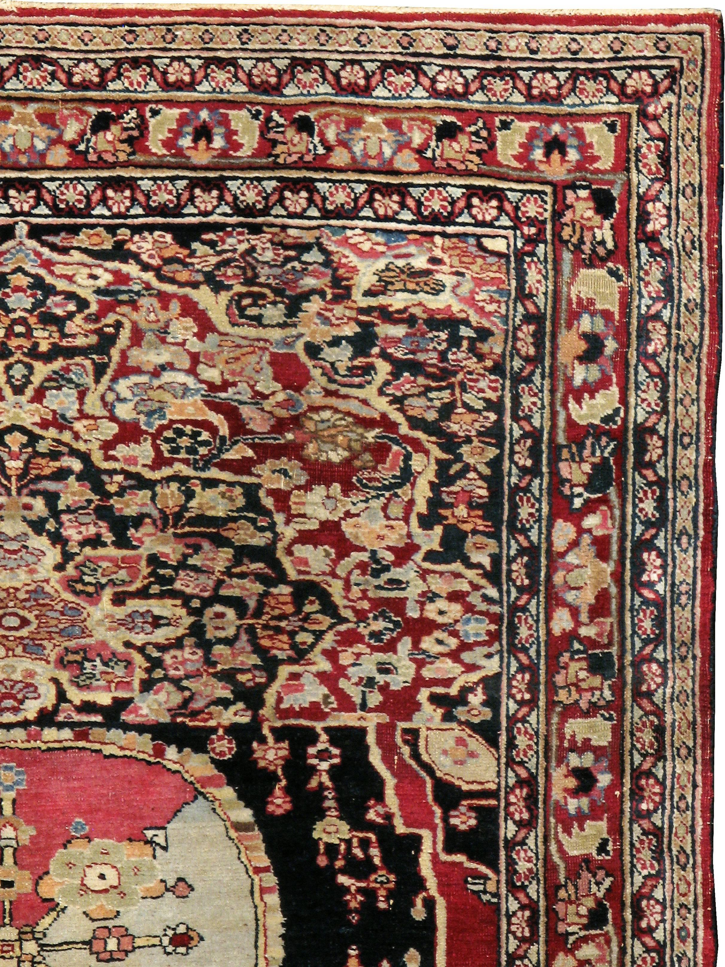 An antique Persian Mashad carpet from the second quarter of the 20th century.