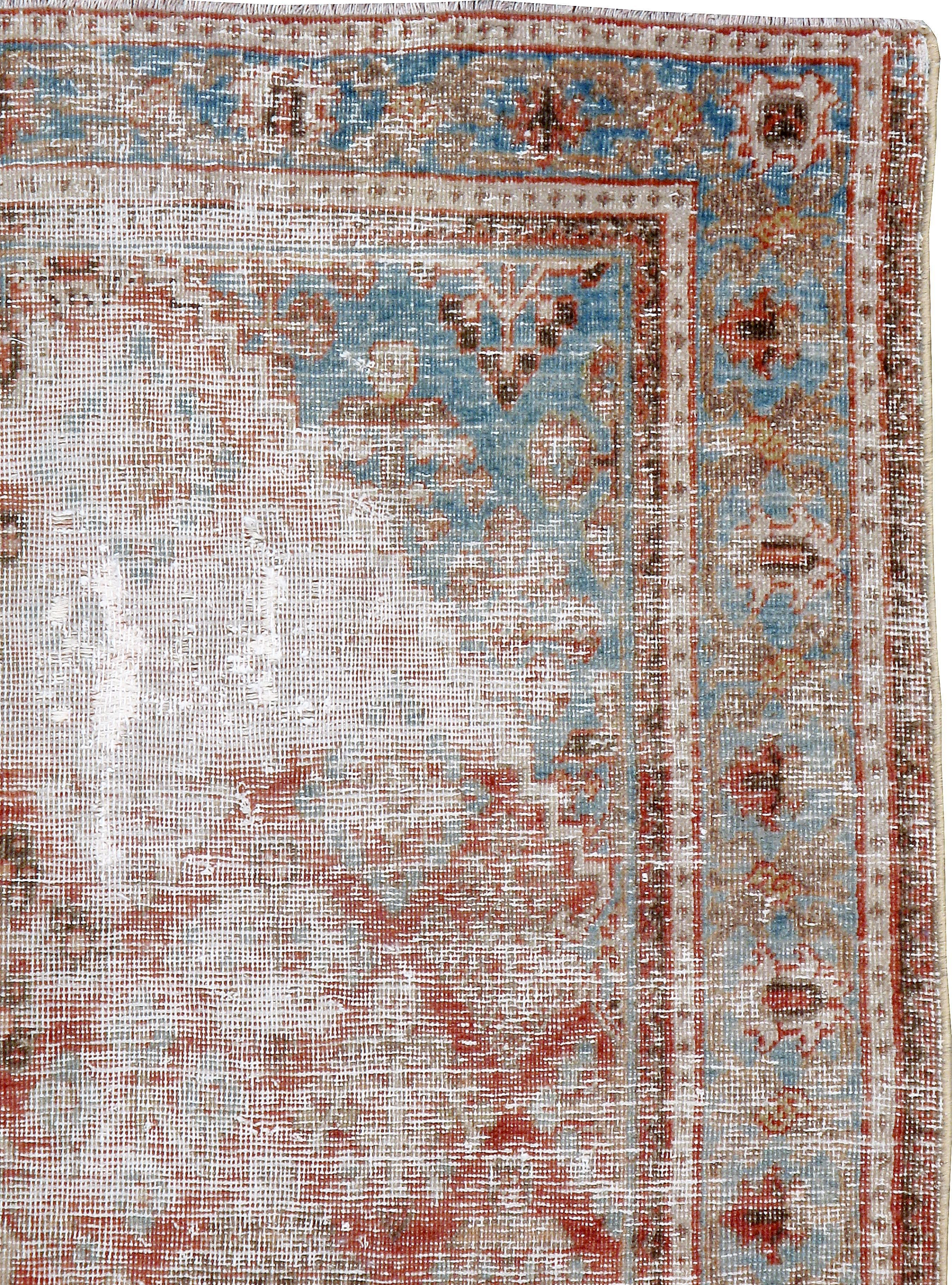An antique Persian Joshegan carpet from the first quarter of the 20th century.