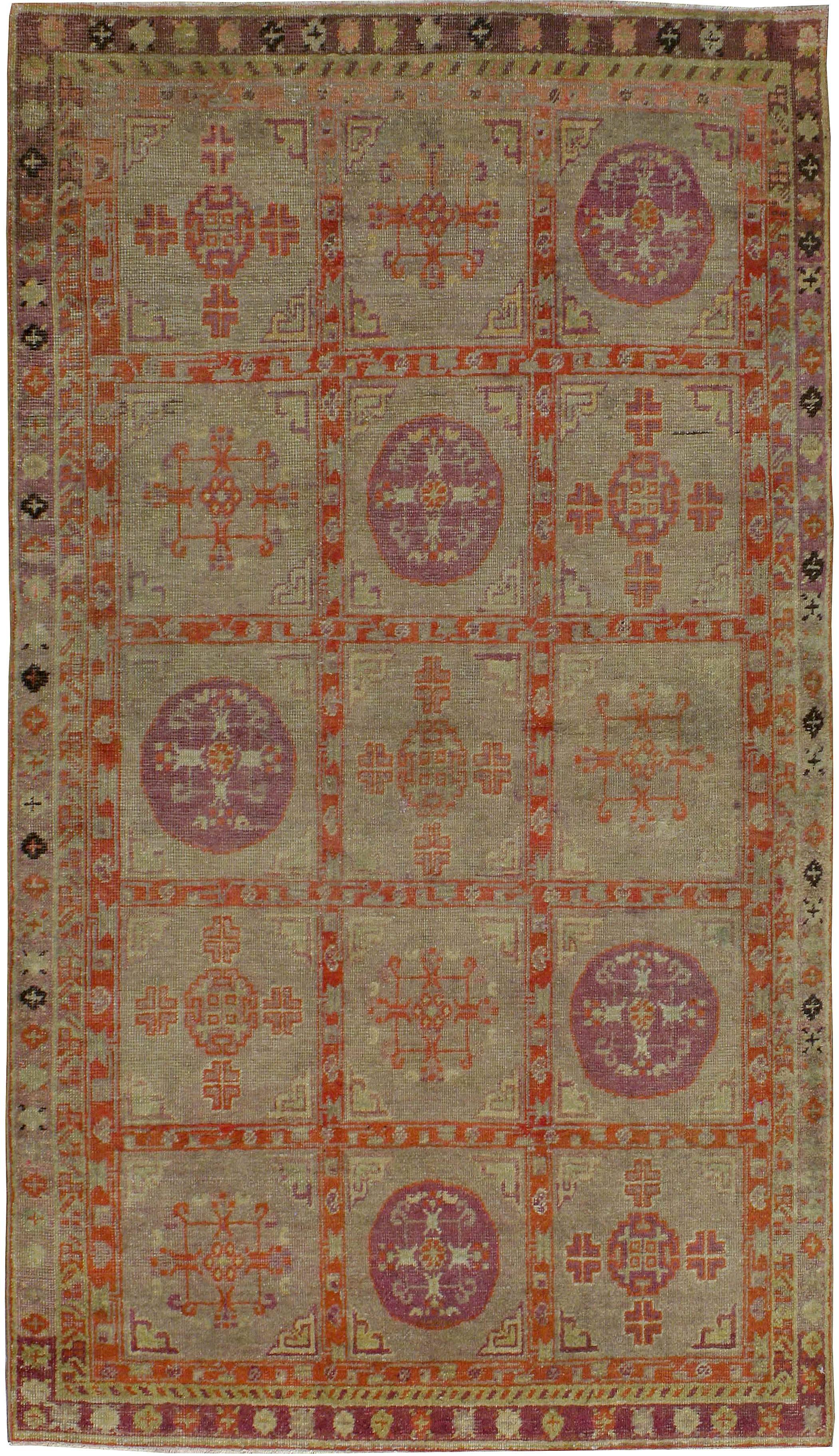 An antique Khotan carpet from the first quarter of the 20th century. Khotan rugs and carpets were produced in the oasis town of Eastern Turkestan, today part of the Xinjiang region in Western China. This area has had a steady production of carpets