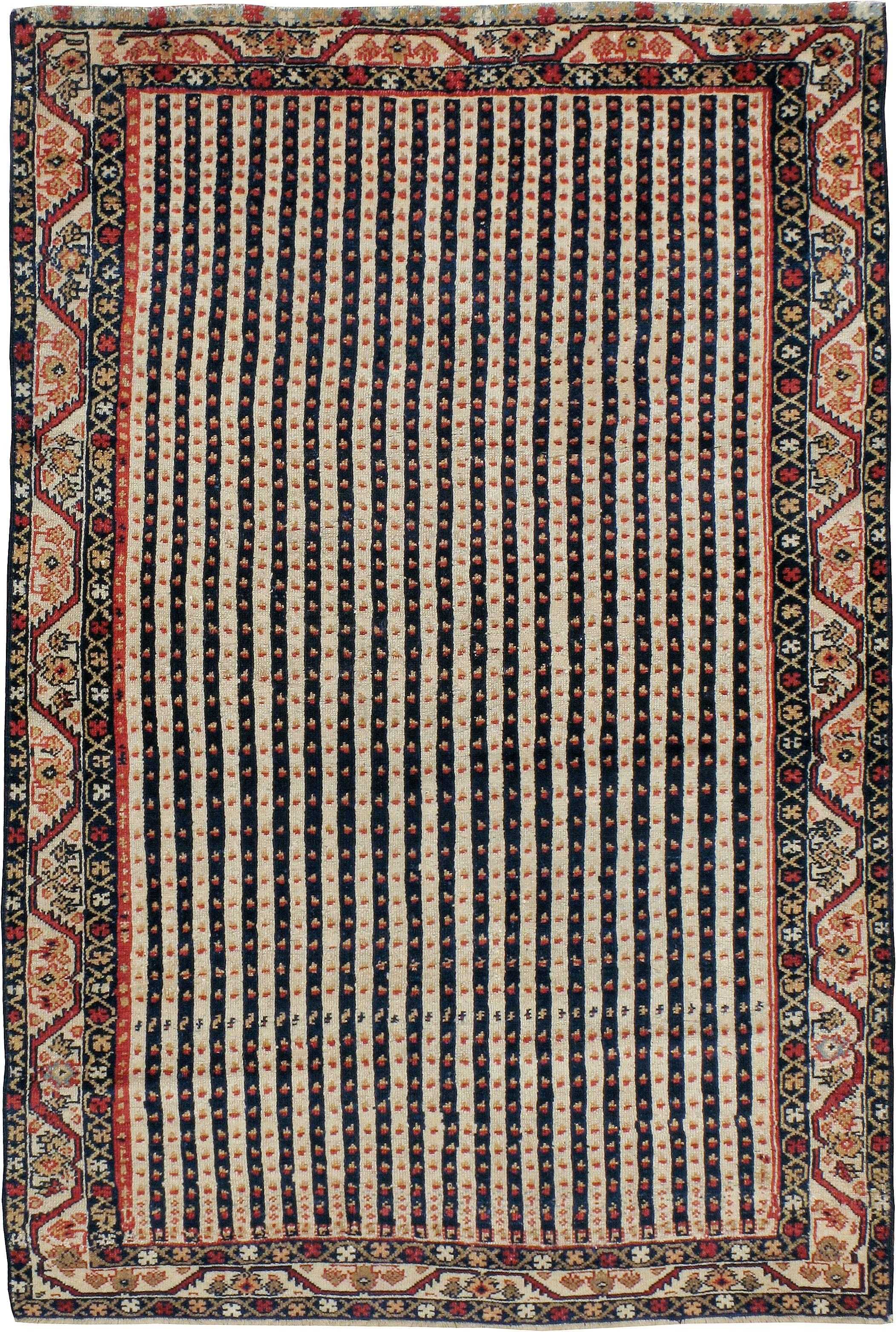 An antique Persian North West carpet from the first quarter of the 20th century.