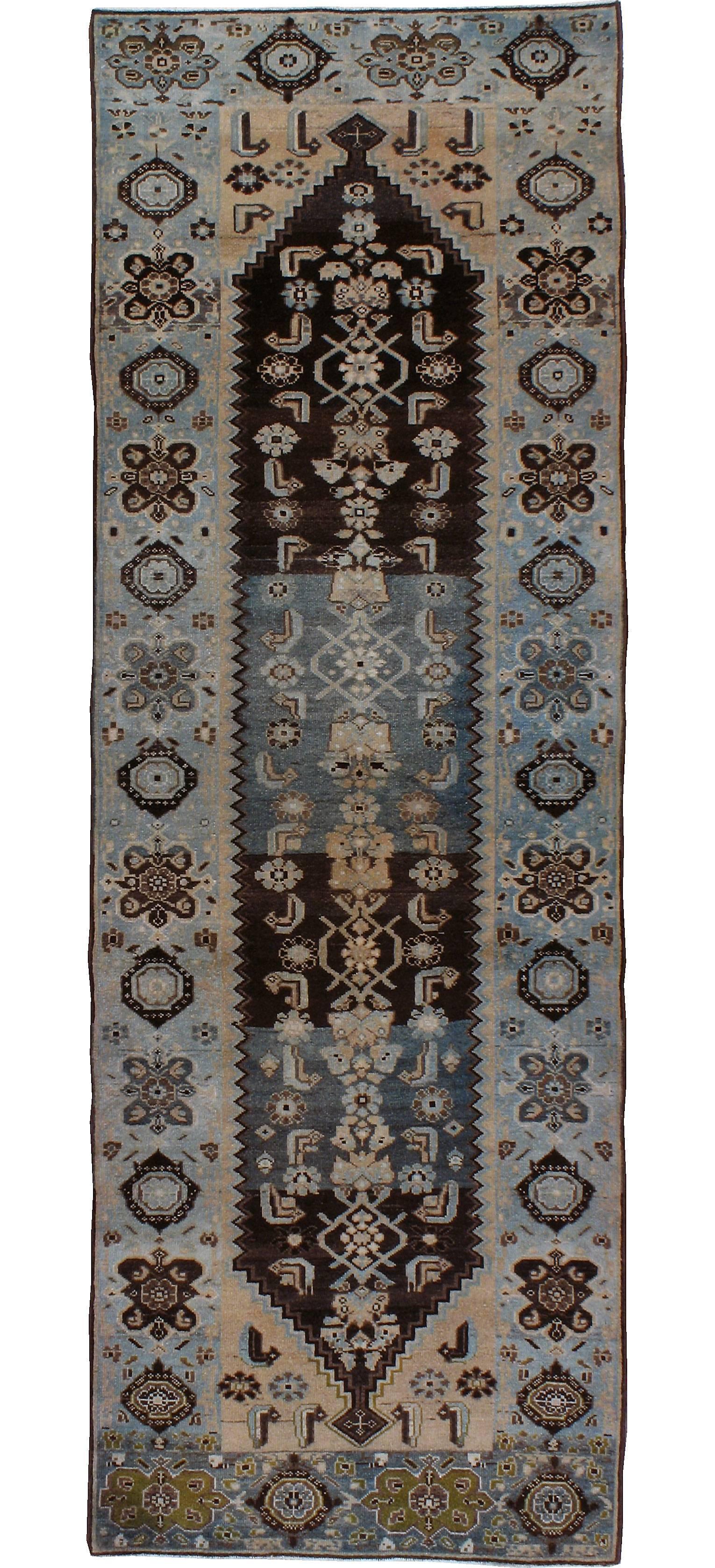 An antique Persian Malayer carpet from the first quarter of the 20th century. Malayer is one of over 100 weaving villages outside of Hamadan in Northwestern Iran. The patterns of Malayer rugs are primarily geometric and one Classic pattern ‘boteh’