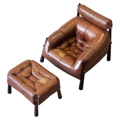 Sillón y reposapiés Percival Lafer MP-81 de los años 70, en cuero marrón original