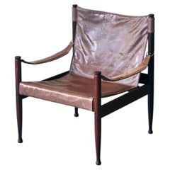 Anni ’60: sedia “Safari” di Erik Wørts in palissandro e pelle per Niels Eilersen.