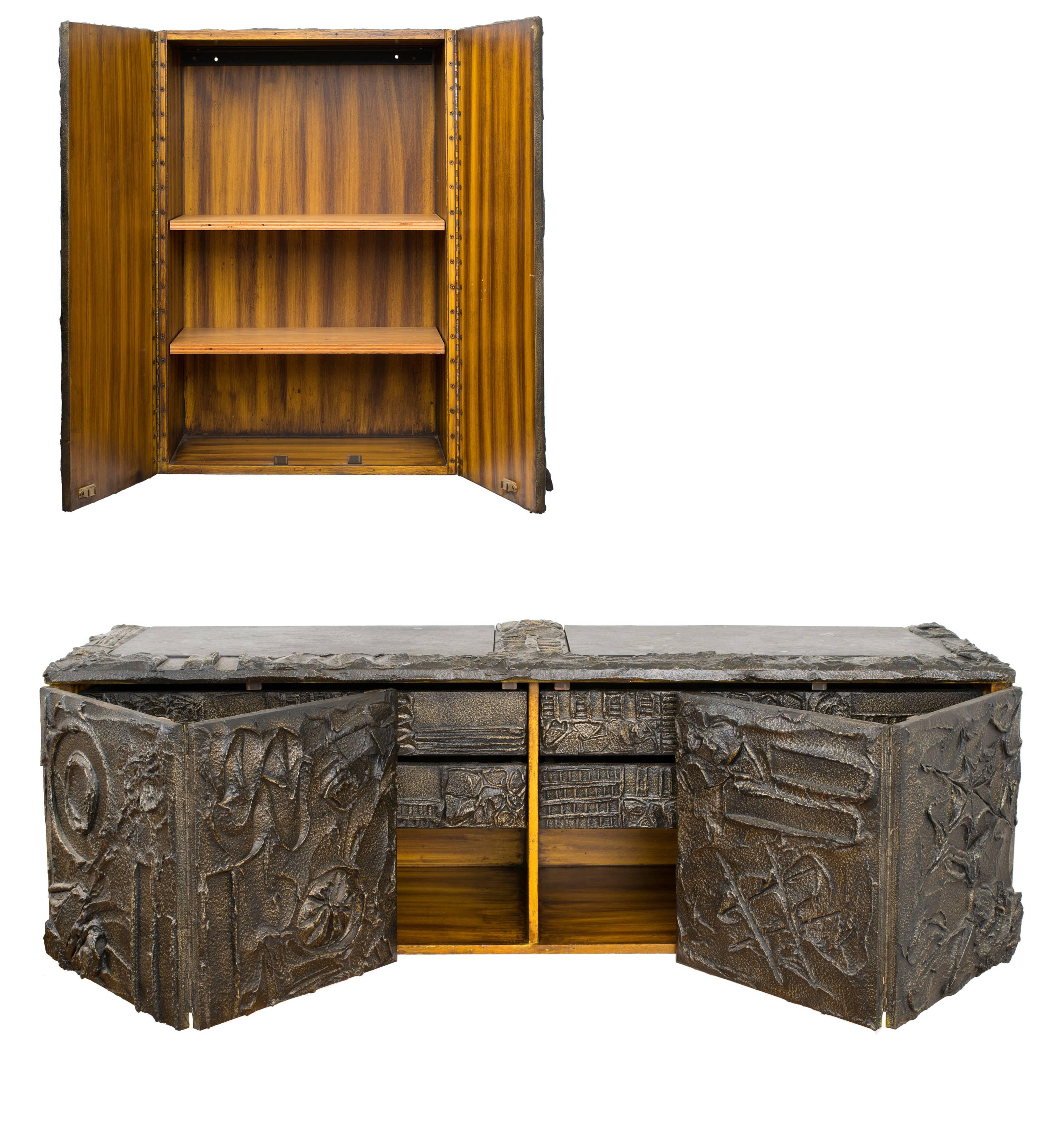 * cabinets also available individually. Please inquire with Satyricon.

A gorgeous, matched pair of wall-mount cabinets by Paul Evans, 1971, executed in hand-sculptured bronze resin with dramatic, deeply incised designs throughout. 

The floating