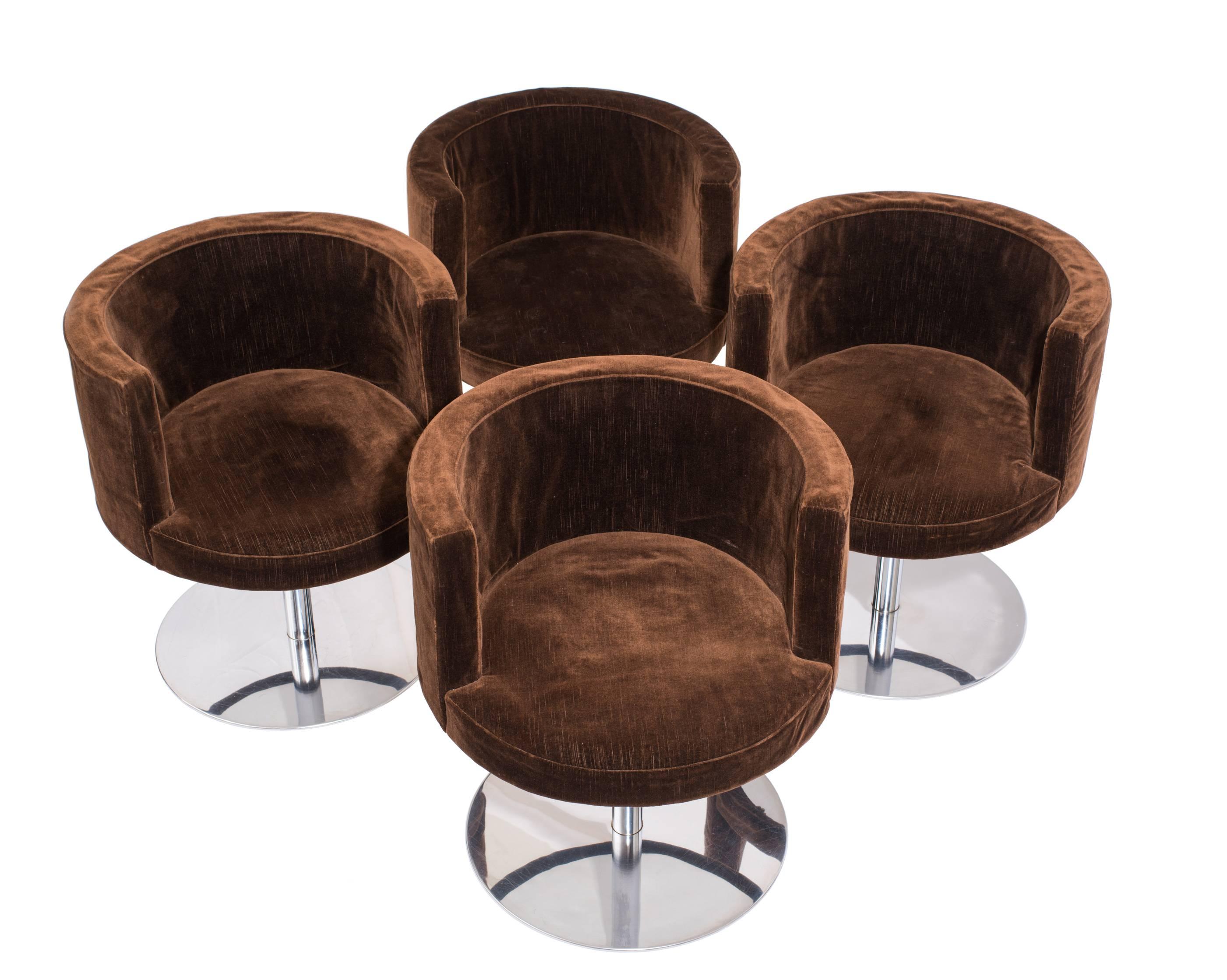 A pair of Harvey Probber swivel chairs, model #3451, with a wonderfully spare form and sleek, stainless steel bases that swivel a smooth 360 degrees. Known as the 'Fraschini' chair and each stamped 'Made in Italy' to the underside, these were