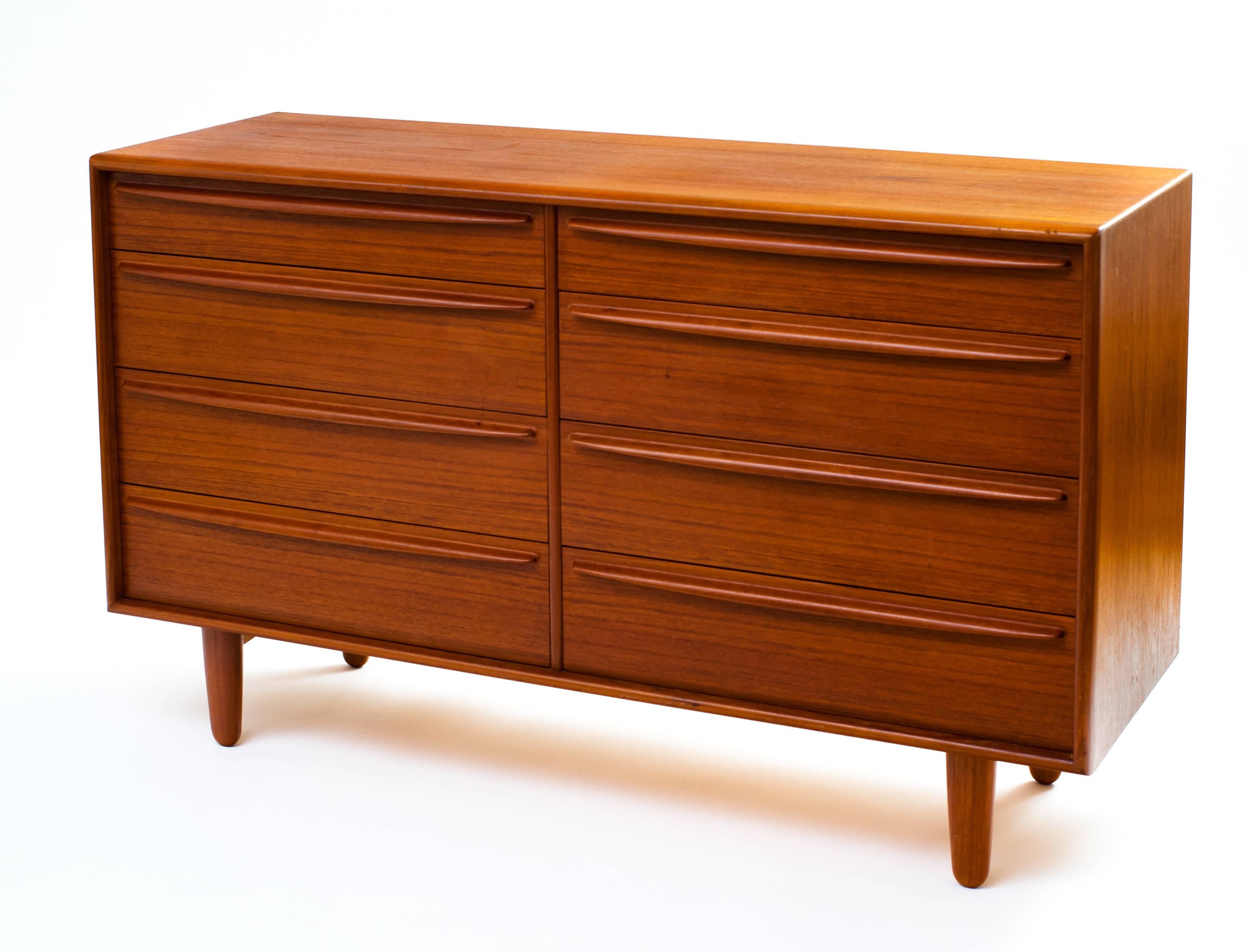 A chest of drawers in teak by Svend Madsen for Falster, 1960s. This is a gem of Scandinavian craftsmanship with features that made it costly to produce at the time: the elegantly radiused drawer pulls and complementing bullnosed front edges, the use