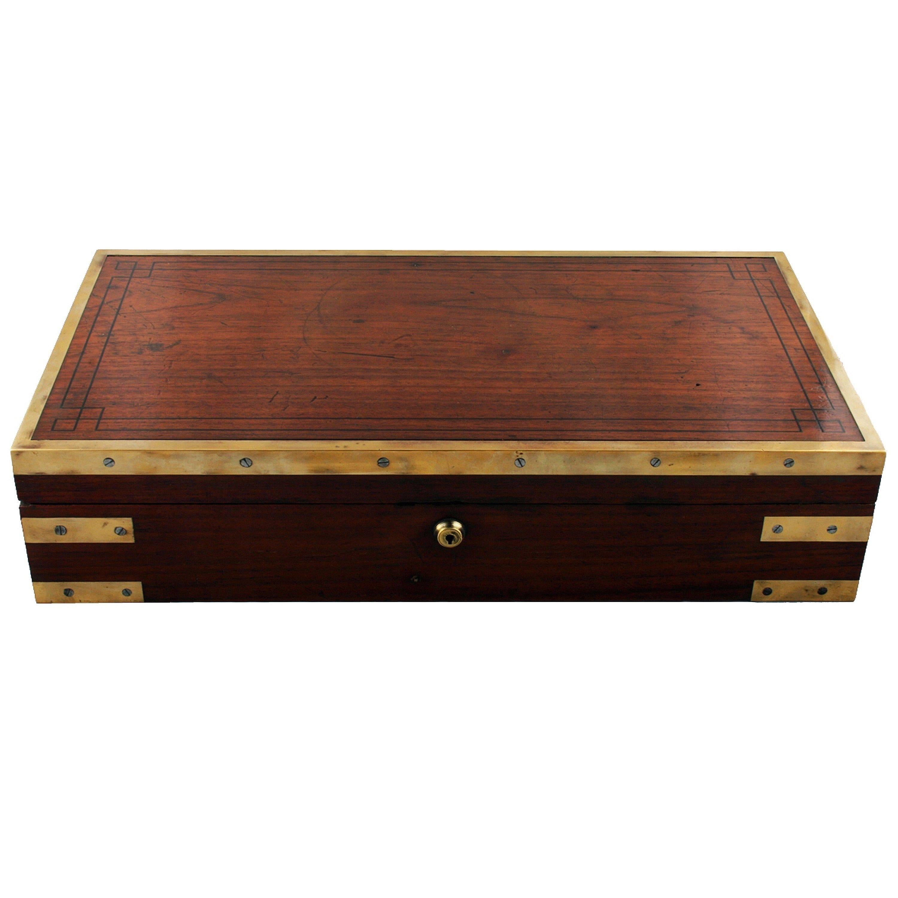 A fine English Campaign document box of brass-bound teak from the George III period, circa 1820.

The box is heavily bound in brass with hand made steel screws, the lid has ebony line inlay, brass hinges and a lock that is engraved 'G.R & Patent'.