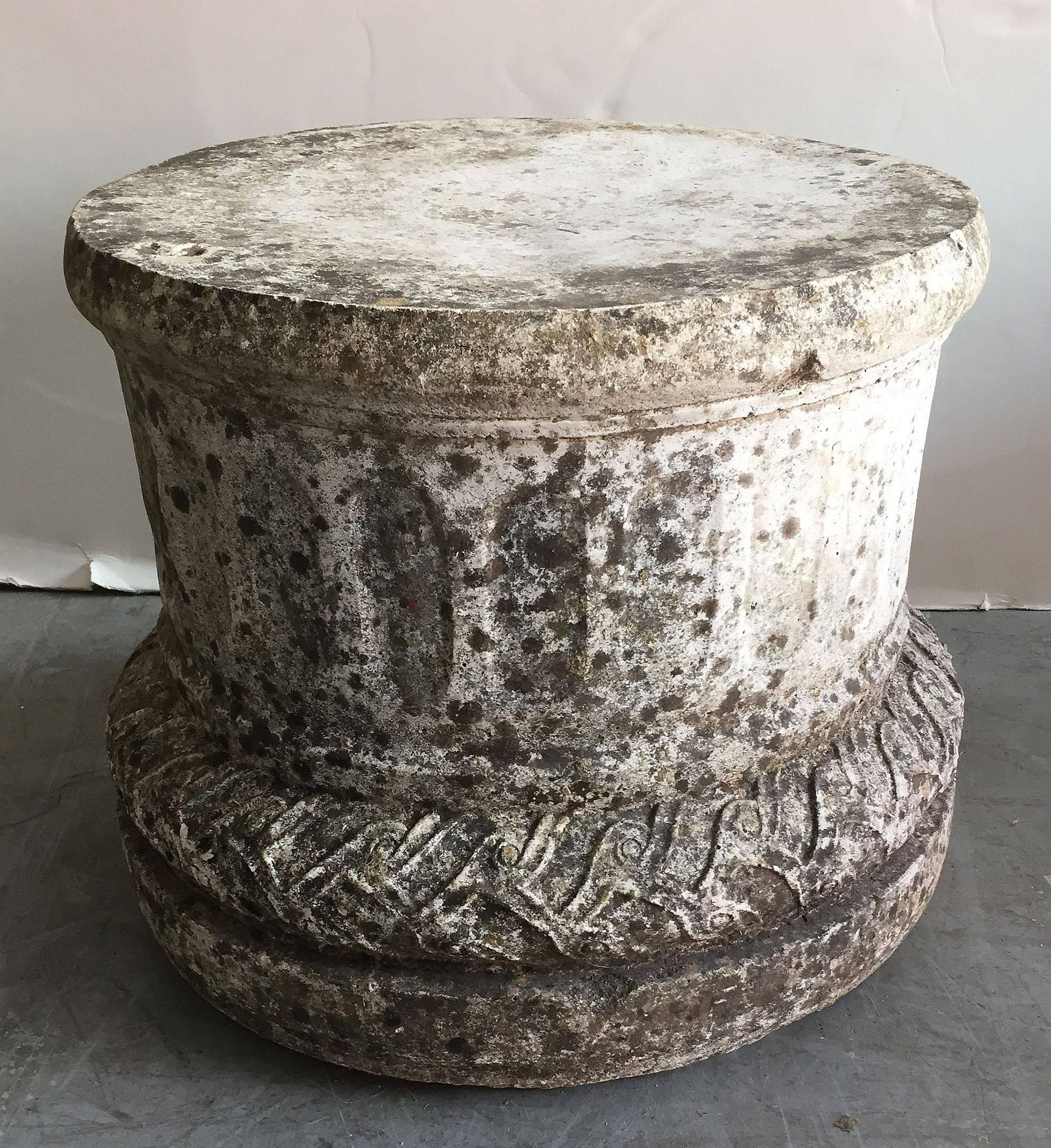 A classic English round or circular garden pedestal plinth of composition stone, with a column design and featuring fine detail around the base.

Measures: H 13 1/2