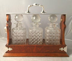 English Tantalus or Decanter Set for Spirits of Oak and Silver