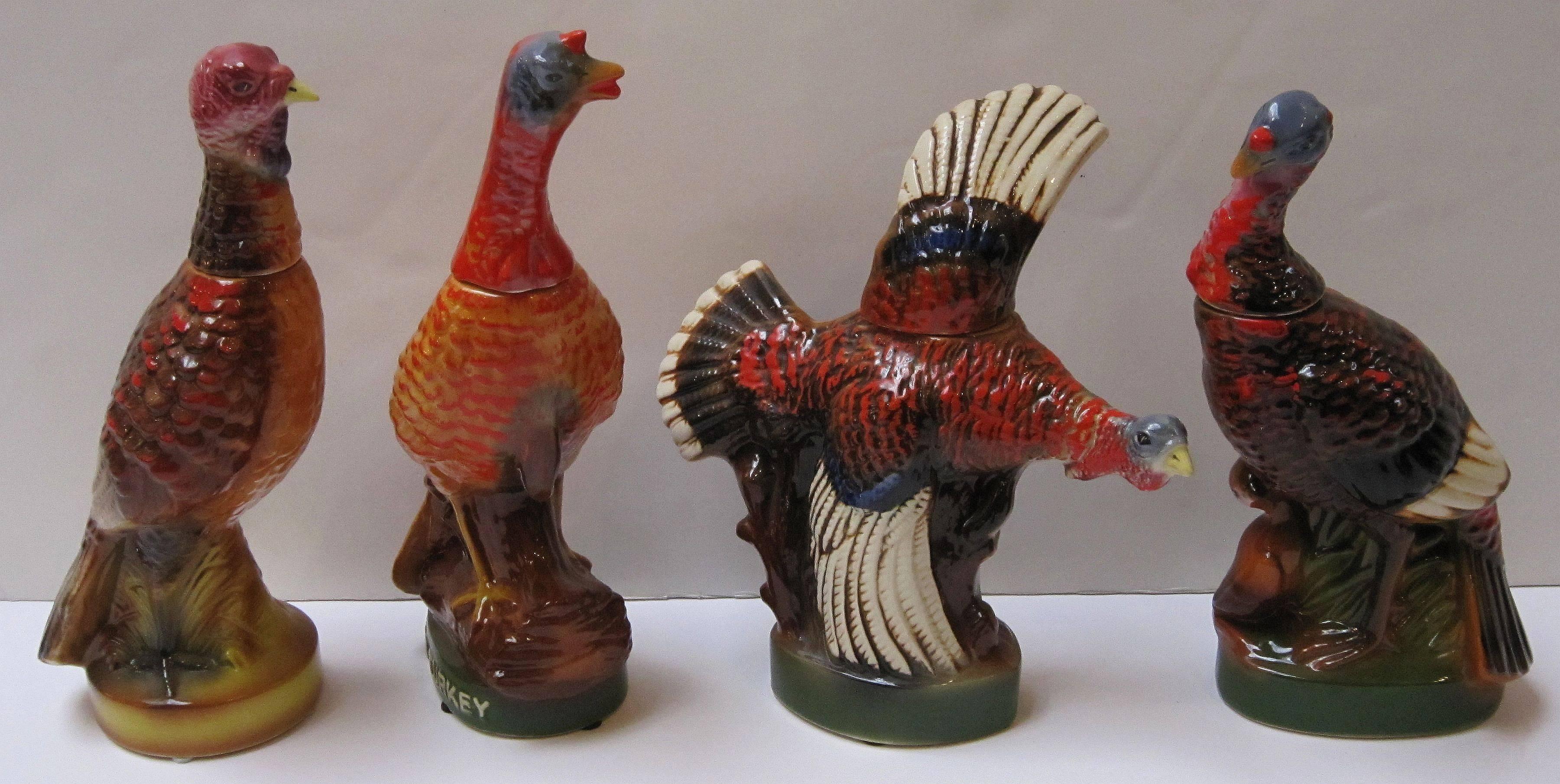 A set of eight large vintage Wild Turkey decanters featuring the hard-to-find #1 and #2 decanters and the popular #3 flying and #8 fan-tail decanters.

Marked on base: Austin Nichols ceramic creation liquor bottle, Wild Turkey 101 proof, 8 years