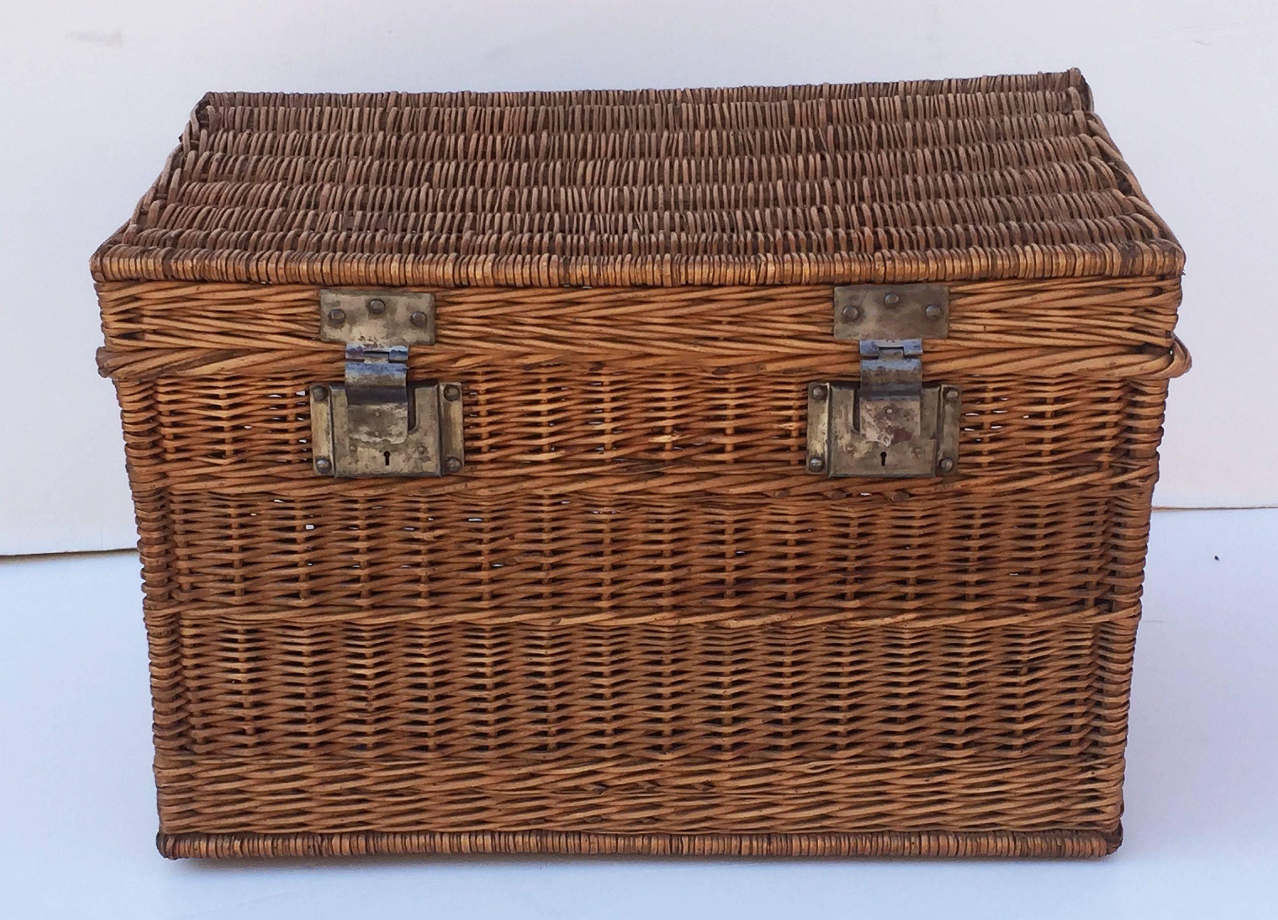 A large French basket hamper of woven willow with brushed steel hardware and handles on each side.

Several available in this style, slight variations of size, please enquire.