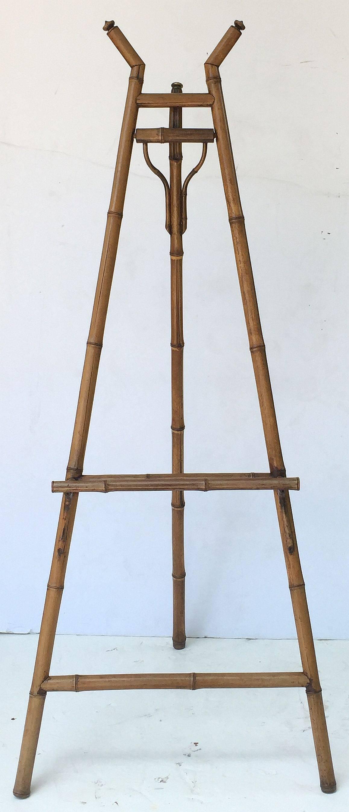 An English bamboo display easel featuring a handsomely patinated frame with fixed lacquer panel support tray.

Dimensions: H 67