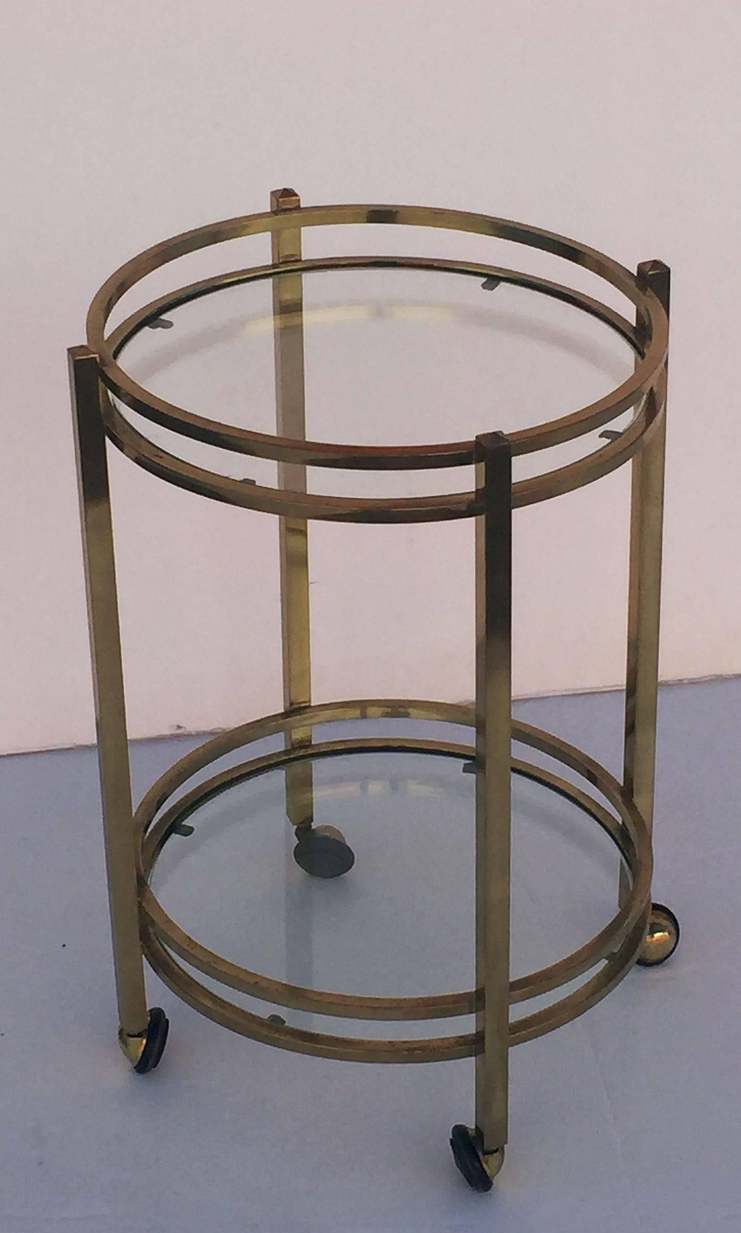 French Two-Tiered Round Table of Brass and Glass on Rolling Casters In Excellent Condition In Austin, TX