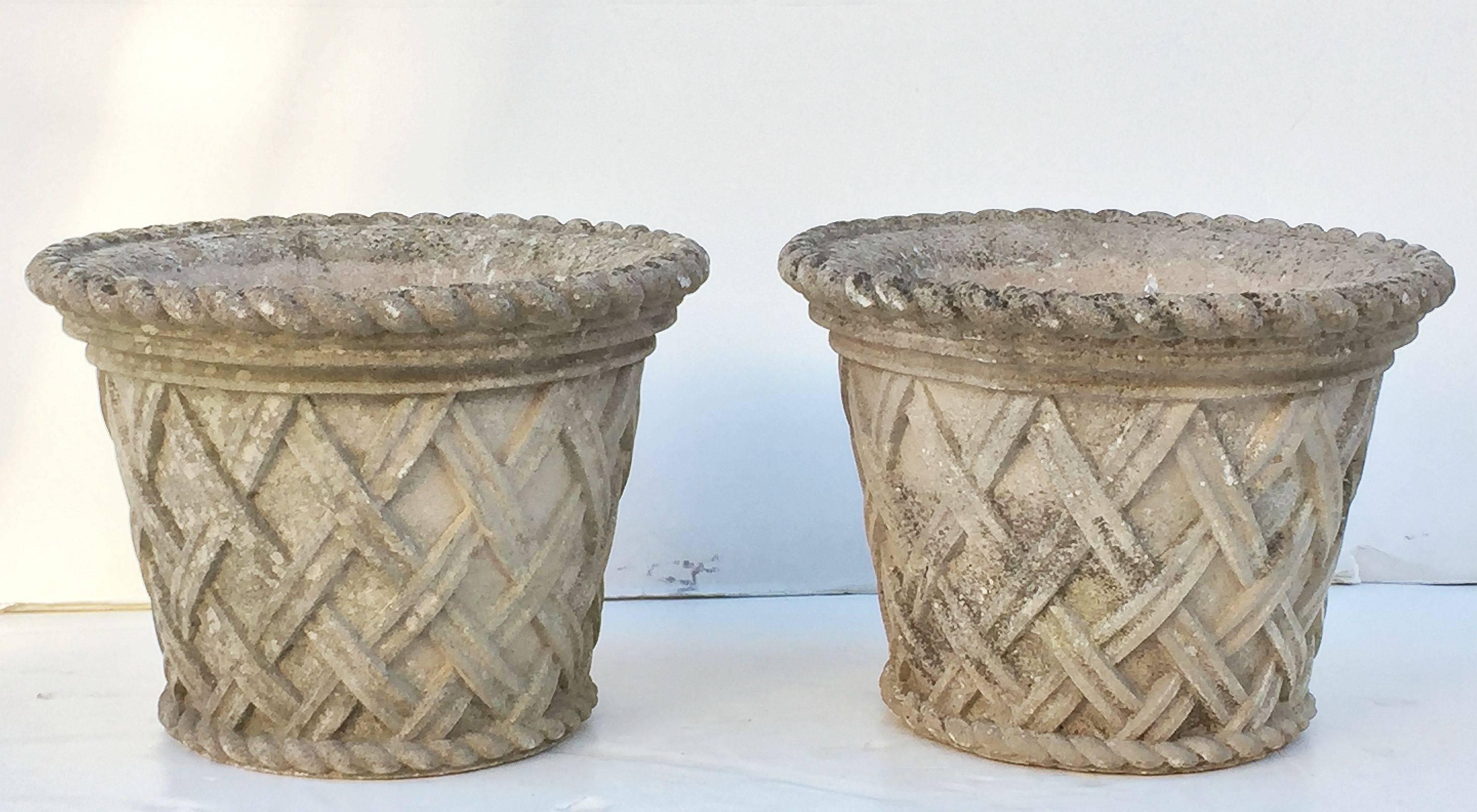 A pair of fine large English garden planters or (jardiniere) urns of composition stone, each 21