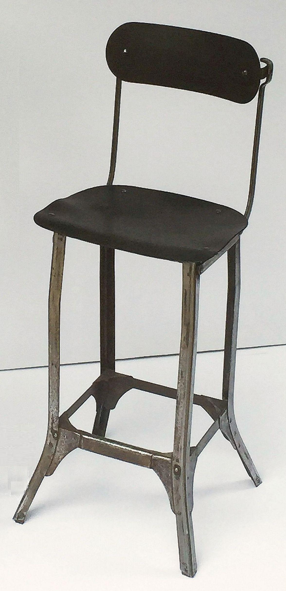 A fine English silversmith's chair, c.1920, from Sheffield, city site of a flourishing silver-smith trade and British Assay office location.
This industrial high chair features a composite seat and back on a brushed steel frame, the back capable of