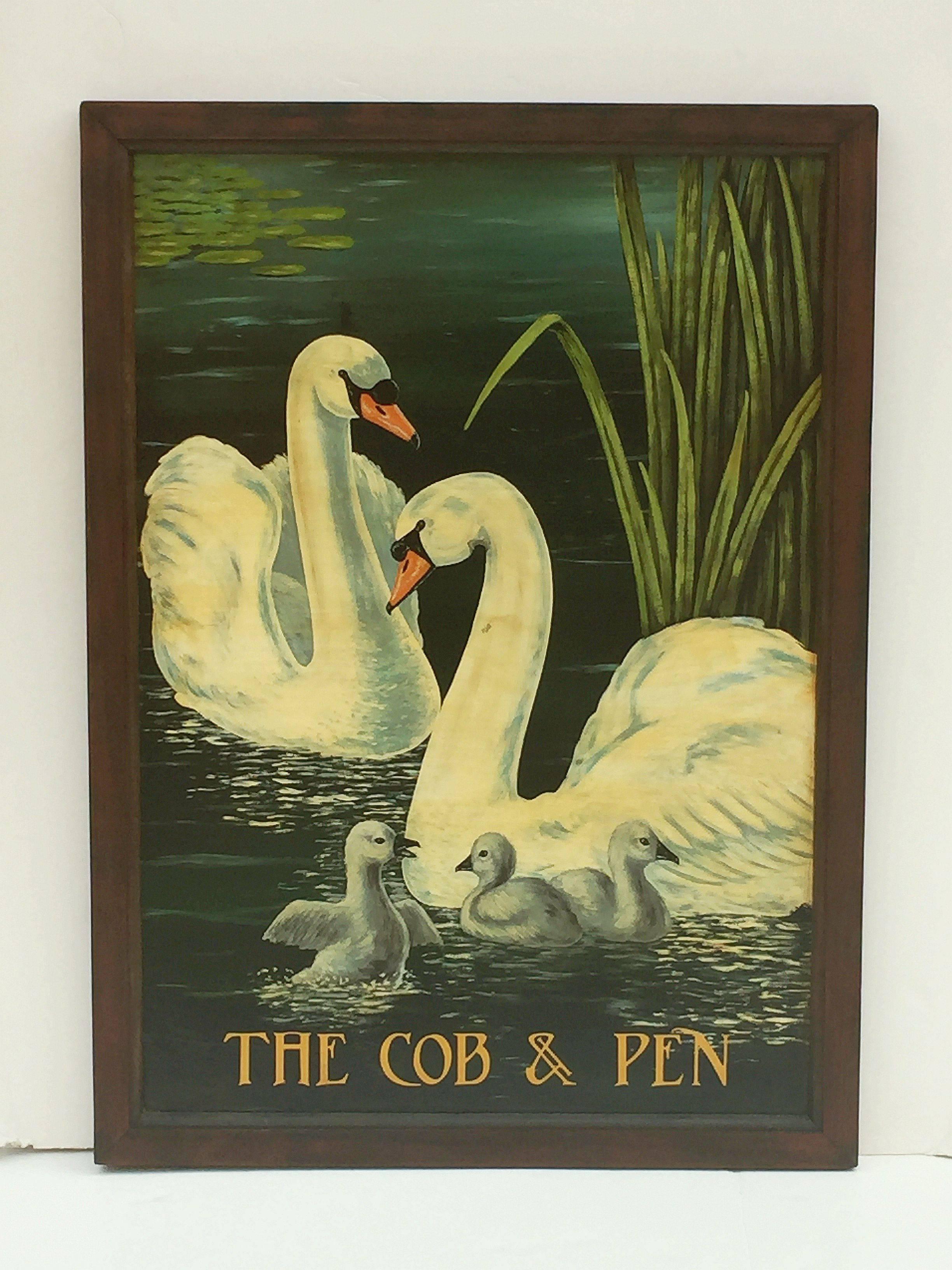 An authentic English pub sign (two-sided) featuring a painting of two adult swans with their three children, next to reeds with lily pads in the background, entitled: The Cob & Pen.

The male swan, called the cob, helps the female, known as a pen,
