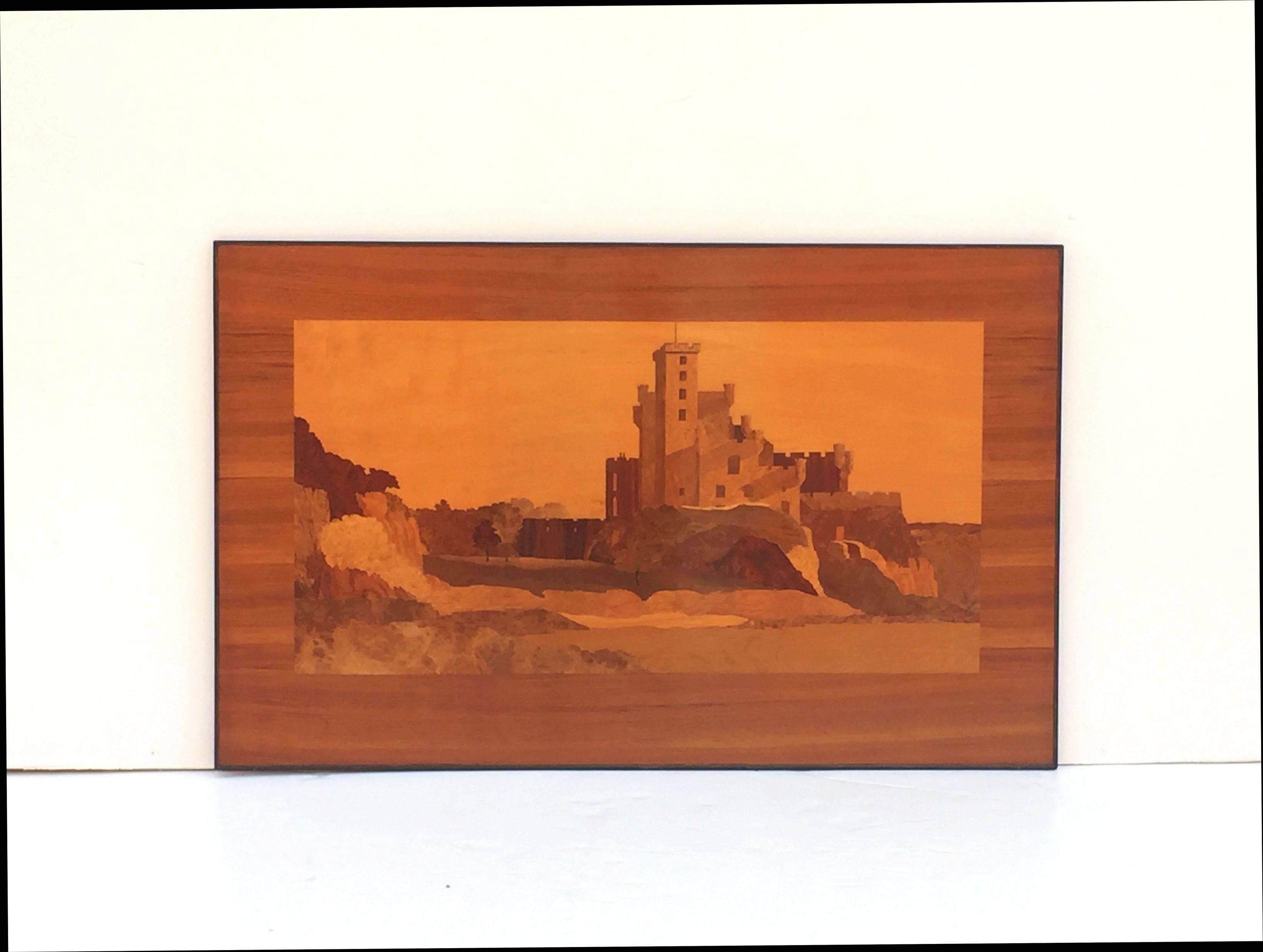 A large Scottish marquetry panel, circa 1920s-1930s, in the manner of Rowley Gallery, inlaid with view of Dunvegan Castle, Isle of Mull, Scotland.

Featuring finely patinated inlaid woods bound in a black metal frame.

Dimensions are: H 31 1/2