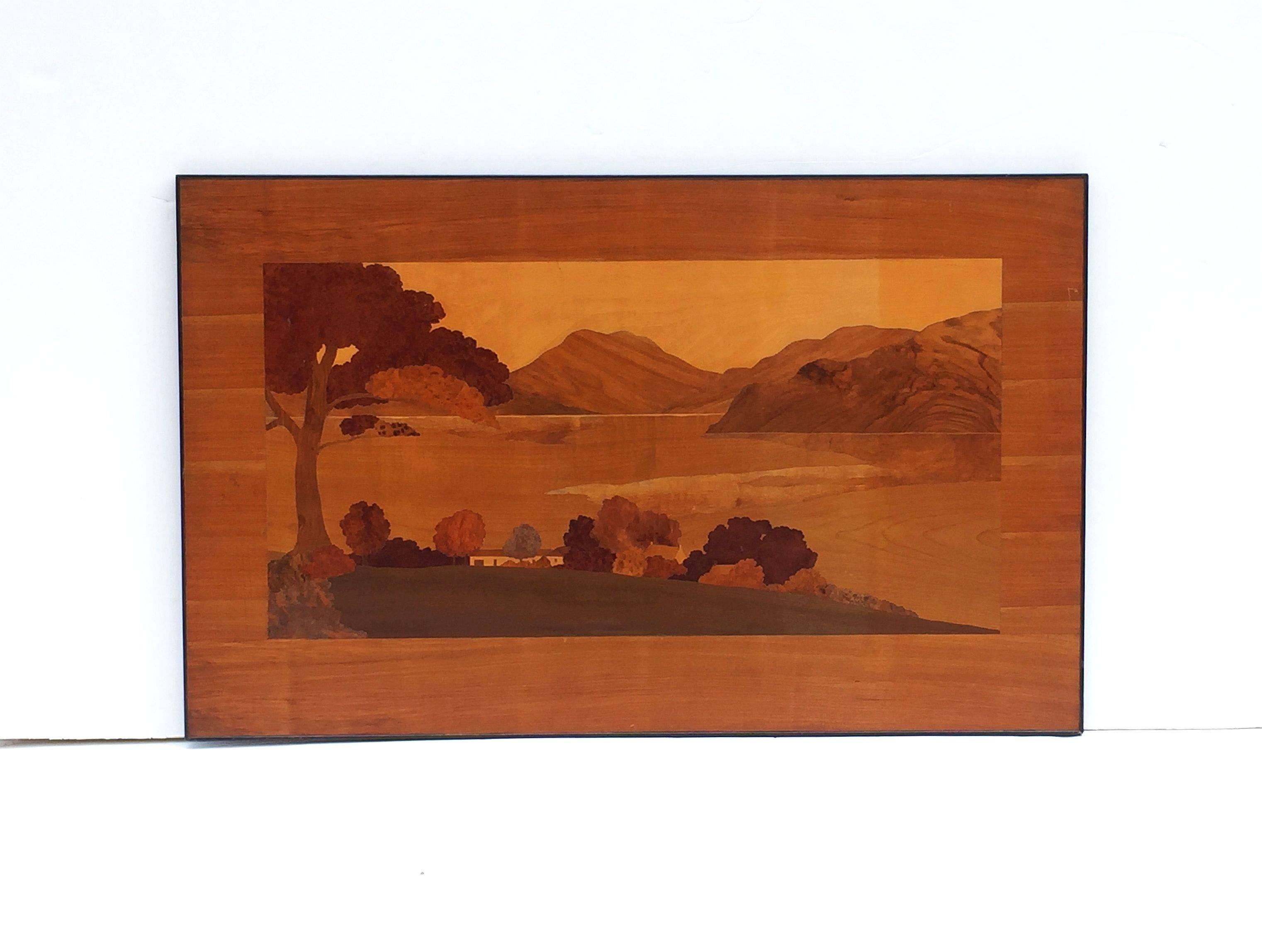 A large Scottish marquetry panel, circa 1920s-1930s, in the manner of Rowley Gallery, inlaid with view of Loch Fyne, Argyll, Scotland.

Featuring finely patinated inlaid woods bound in a black metal frame.

Dimensions are: H 31 1/2