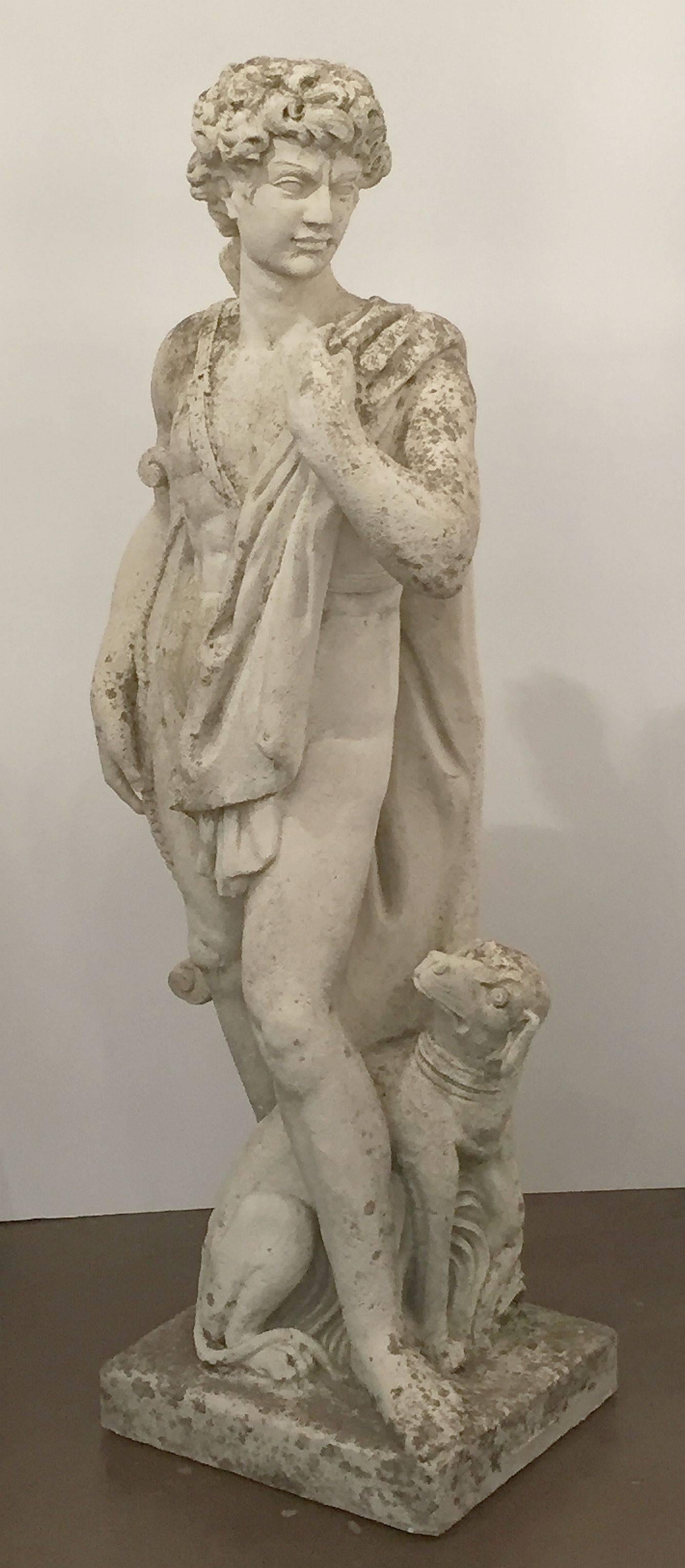 A large finely modeled English garden statue of Apollo, of composition stone, featuring Apollo of the Hunt in a standing pose 