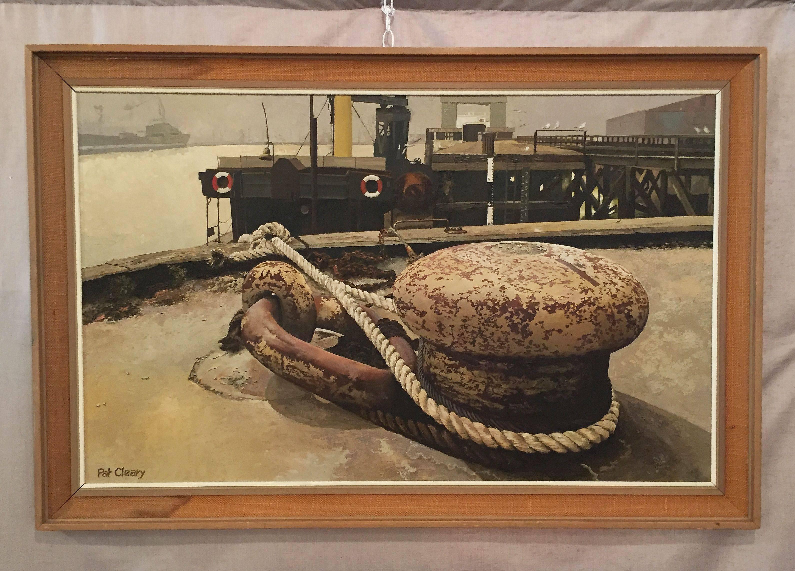 A fine large English oil painting on board, circa 1978, by Pat Cleary, depicting a mooring bollard and ship in a harbour or dock, mounted in a stylish rectangular wood and canvas frame.

Titled: Sunday Morning

Dimensions are H 31 inches x W 47
