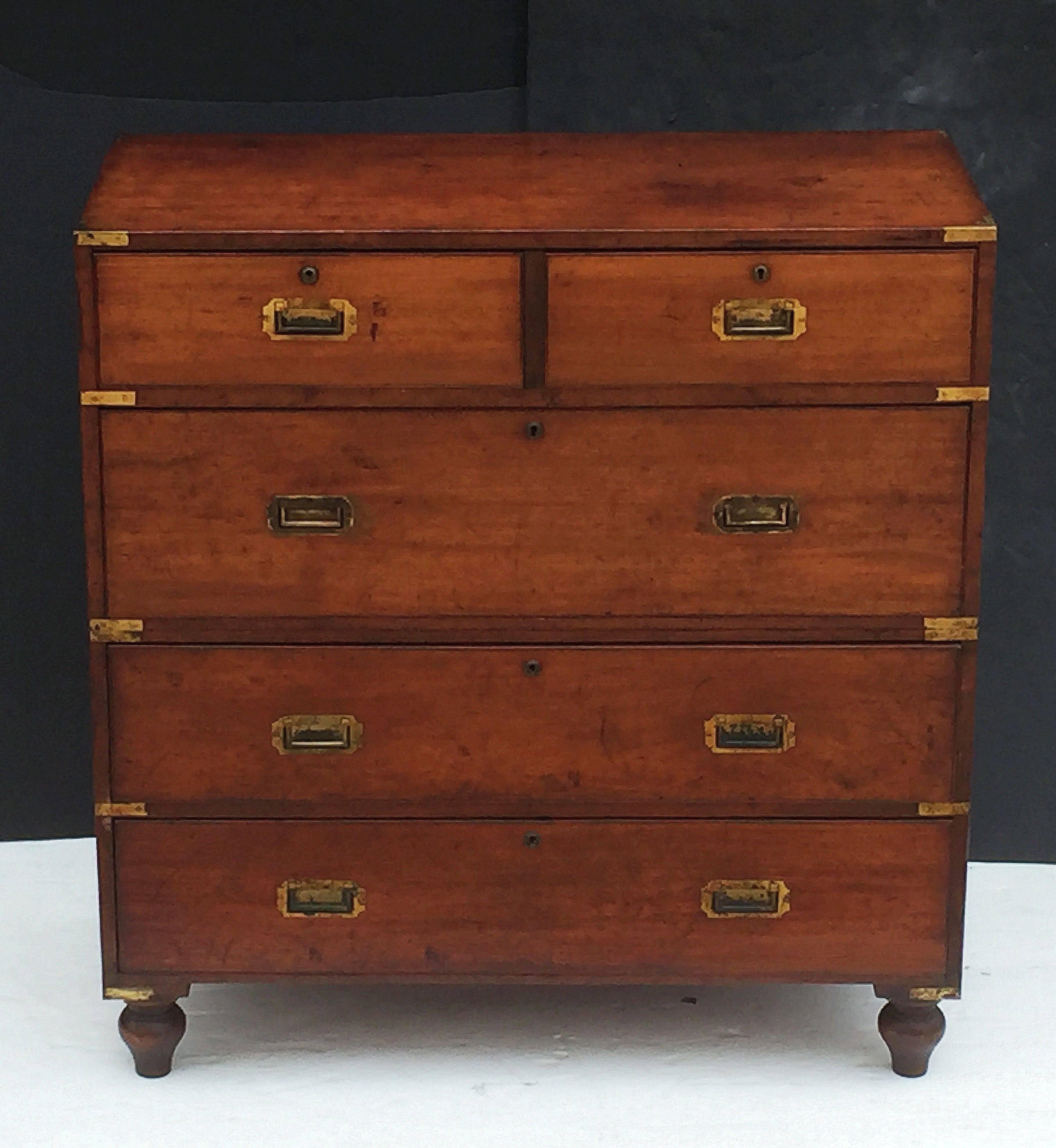 A fine English military officer’s Campaign Ware chest, featuring a handsome teak exterior, showing two short drawers over three long drawers. The brass-bound chest, in two parts, accented with brass hardware, resting on shaped feet.

Campaign-era