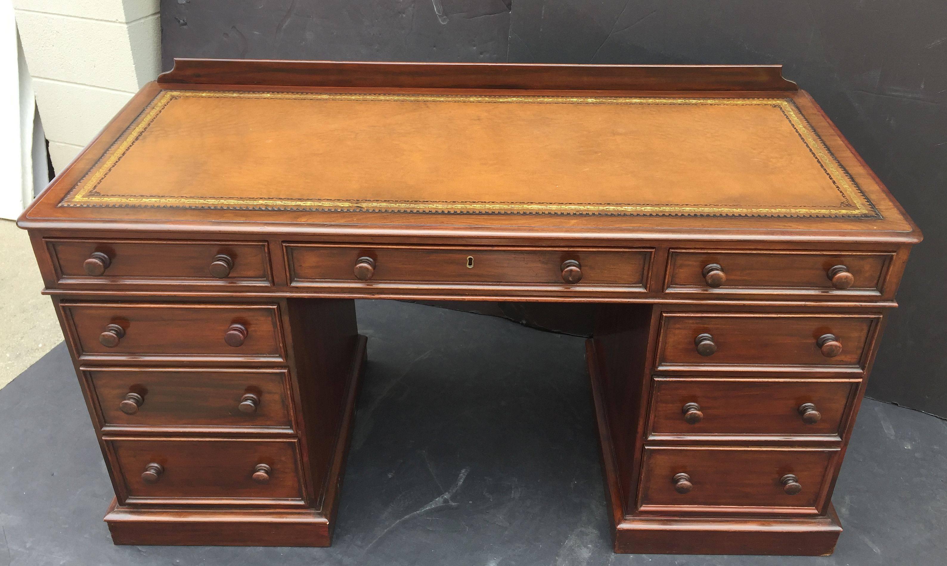Brass English Pedestal Desk of Mahogany with Embossed Leather Top