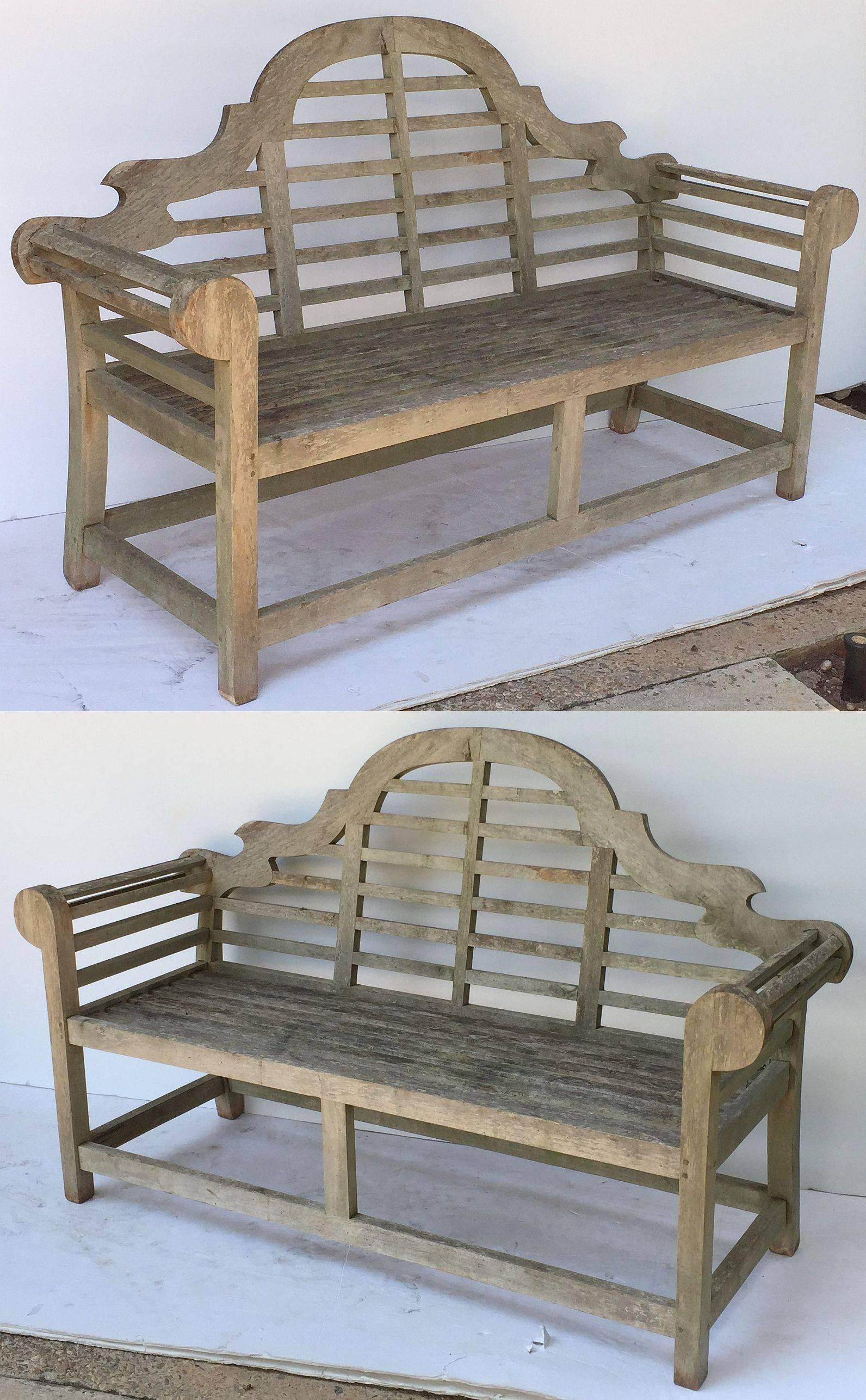 A fine pair of vintage Lutyens style teak garden benches after Sir Edwin Lutyens, the British architect renowned for his imaginative, classic designs throughout England, Ireland and New Delhi (India).

Each bench featuring a high-arched back for
