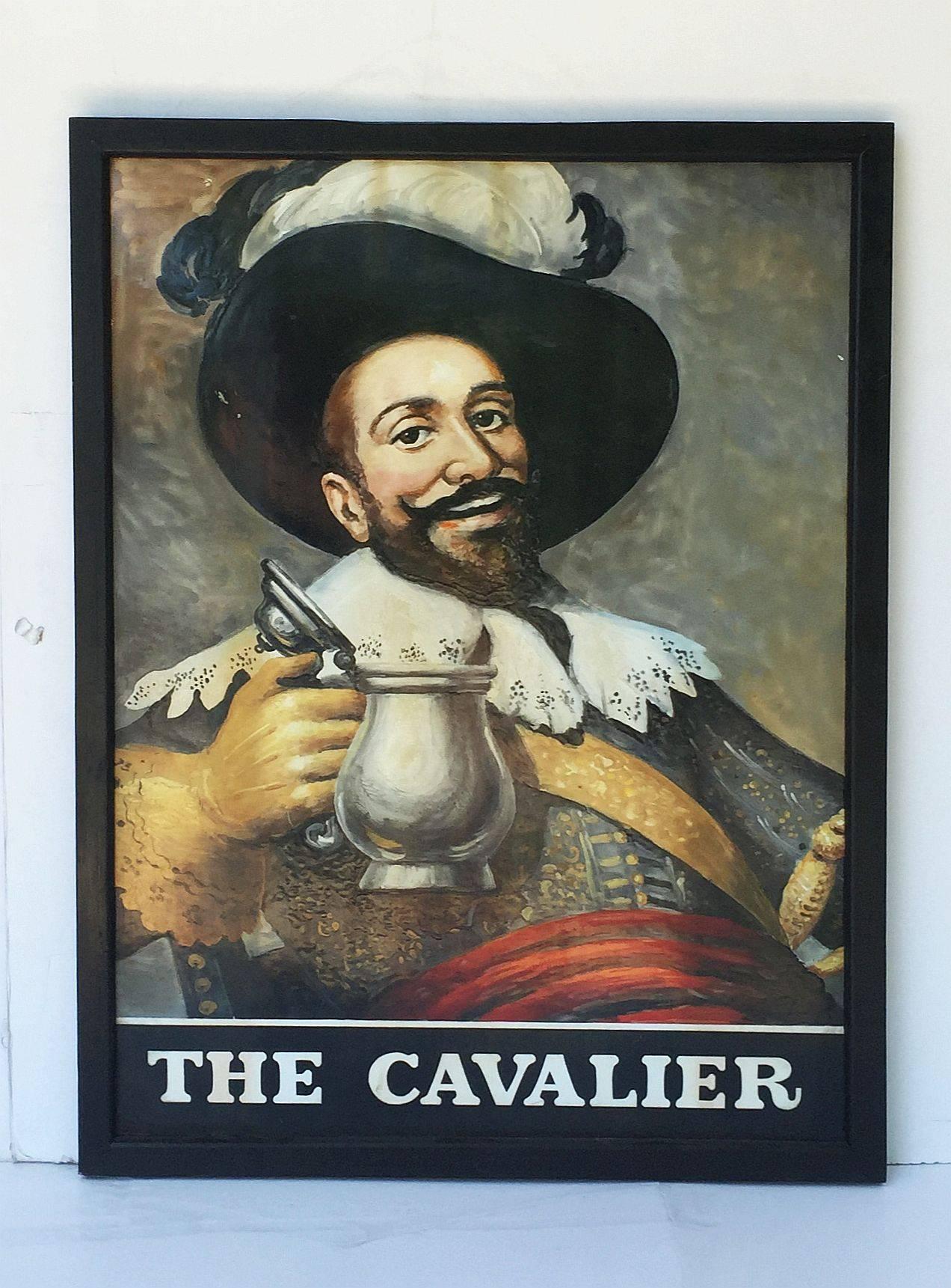 An authentic English pub sign (one-sided) featuring a painting of a smiling man in full 17th century dress holding up an open pewter ale tankard, entitled: The Cavalier

Cavalier was first used as a term for the wealthier Royalist supporters of King