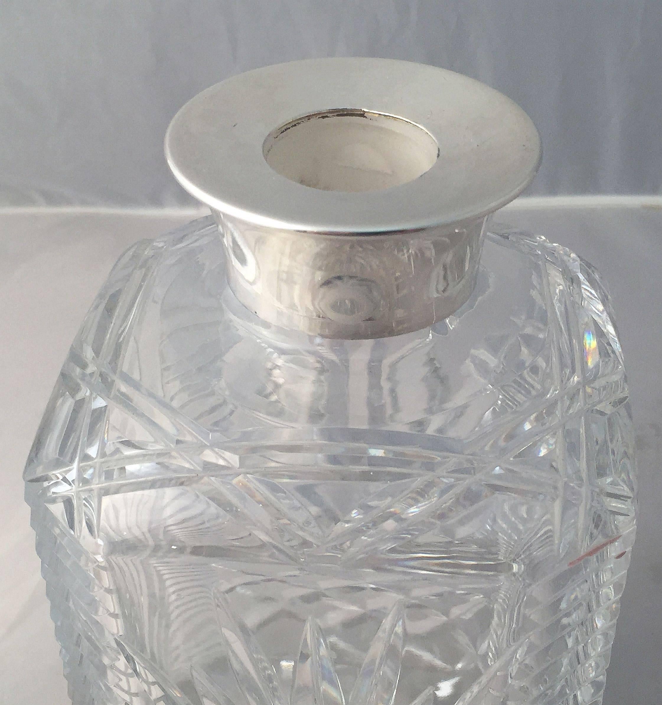 cut glass decanter with silver collar