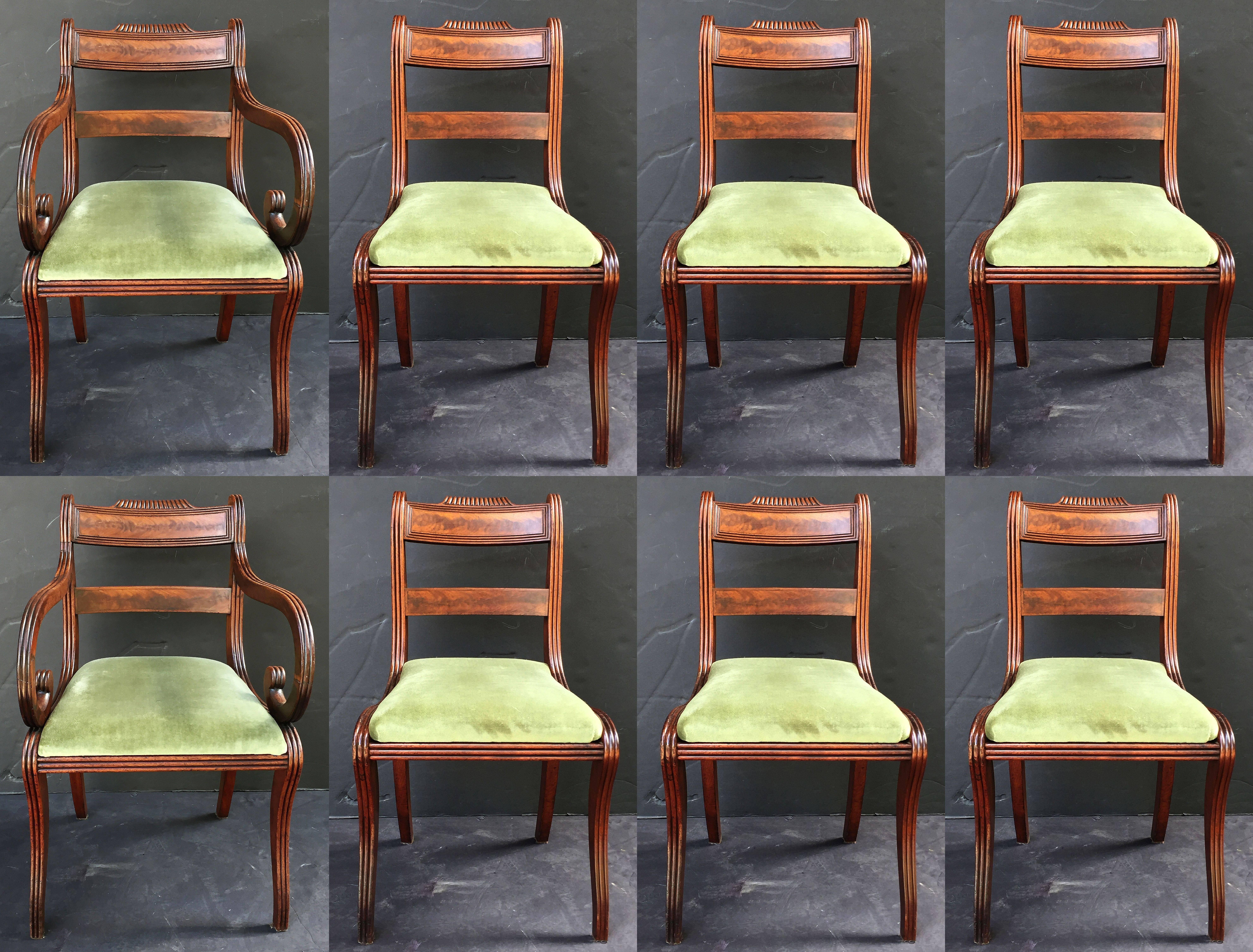 A fine set of eight comfortable dining chairs of mahogany from the Regency era, originally from Scotland.

Each side chair featuring a bowed back of flame mahogany with carved accents, a moulded seat (removable), mounted to four shaped legs.