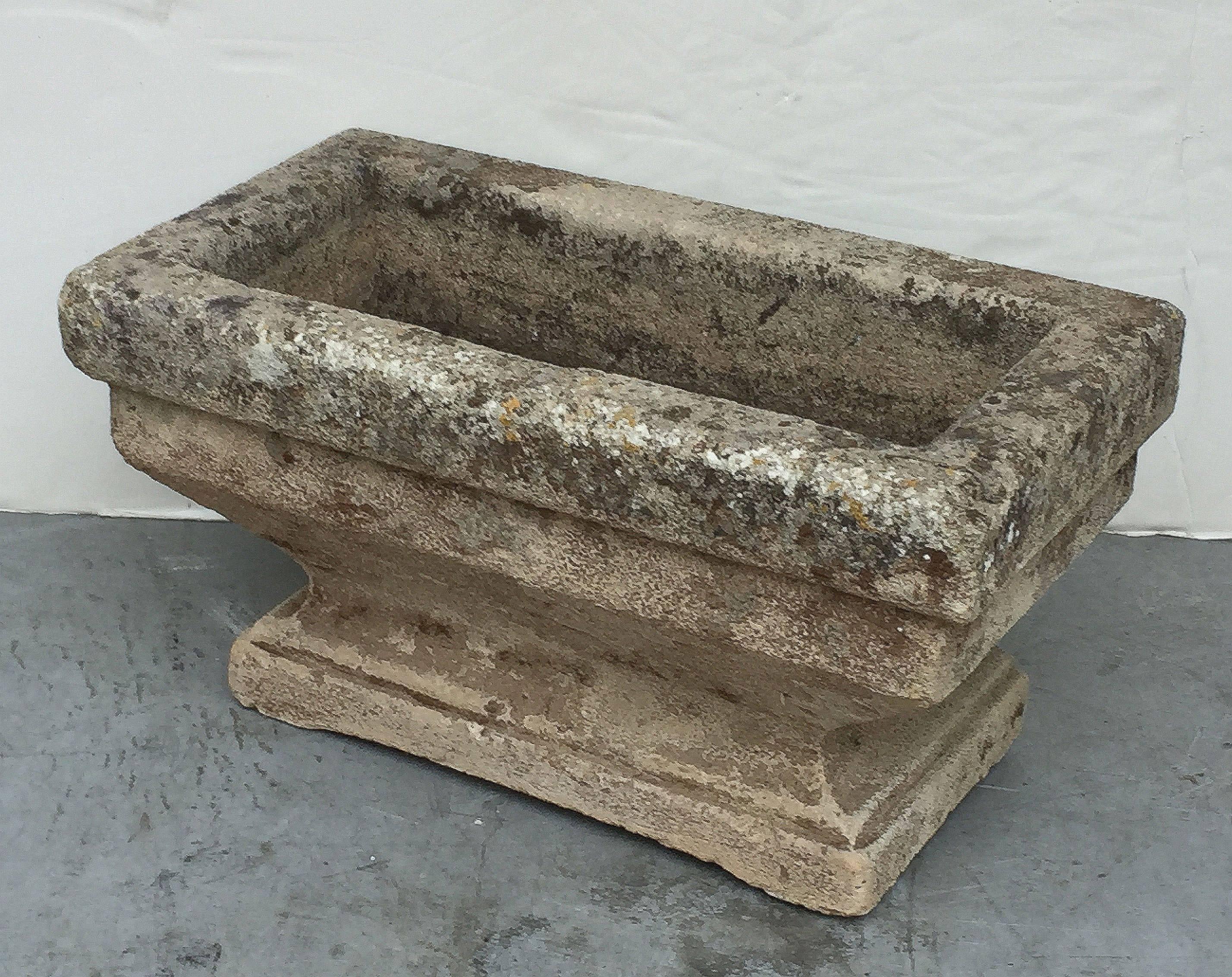 A fine large rectangular English trough or planter of composition stone, featuring a raised top on a shaped base.

 