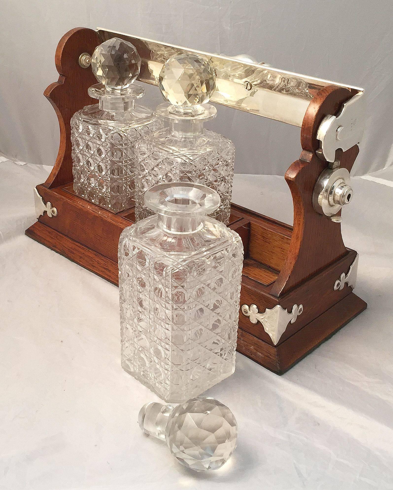Edwardian English Tantalus or Decanter Set for Spirits of Oak and Silver