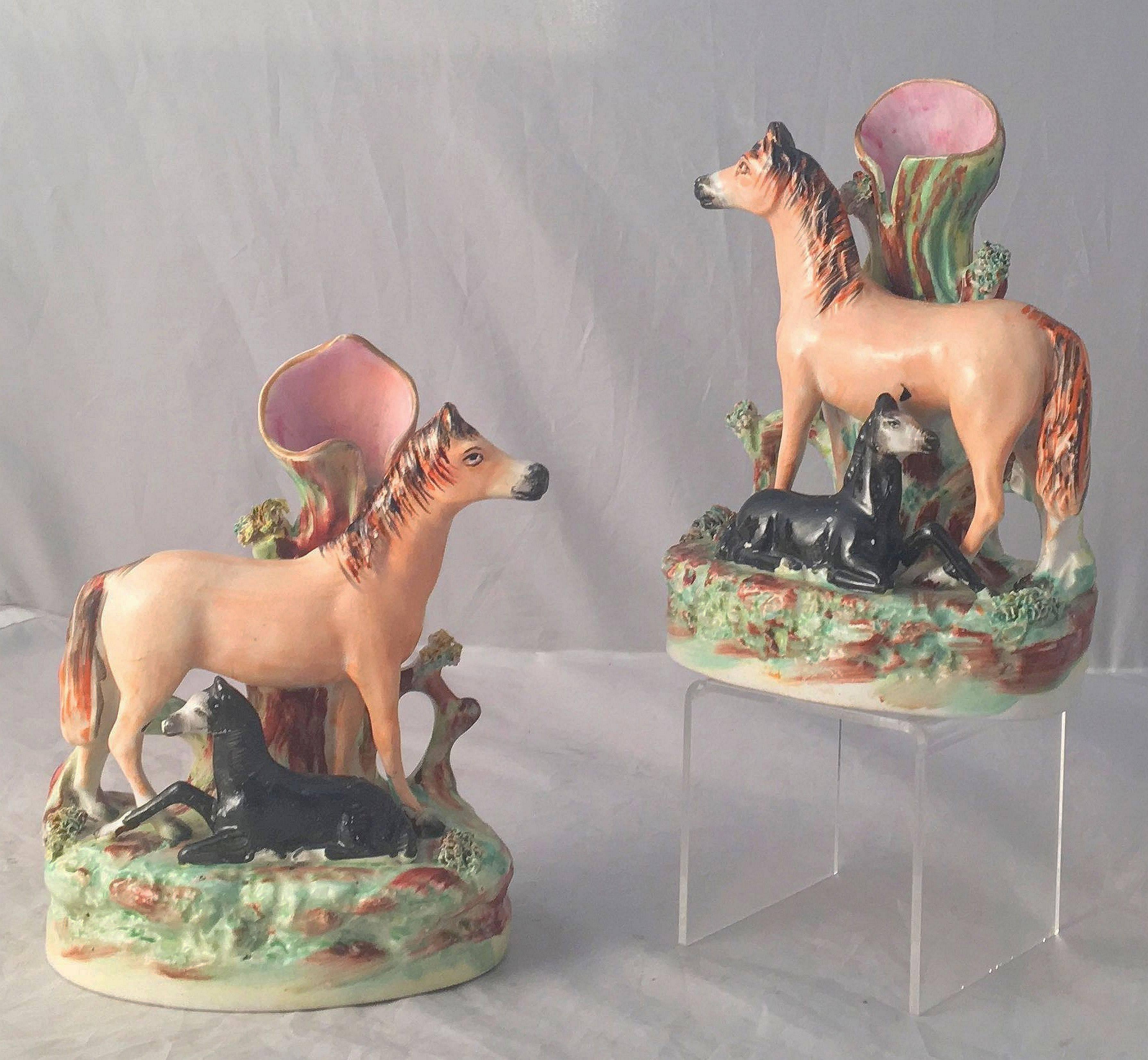 A handsome pair of English Staffordshire pottery decorative spill vases or animal sculptures, finely modelled and colored as standing horses with recumbent foals.

Sold as a pair-$3895 the pair.