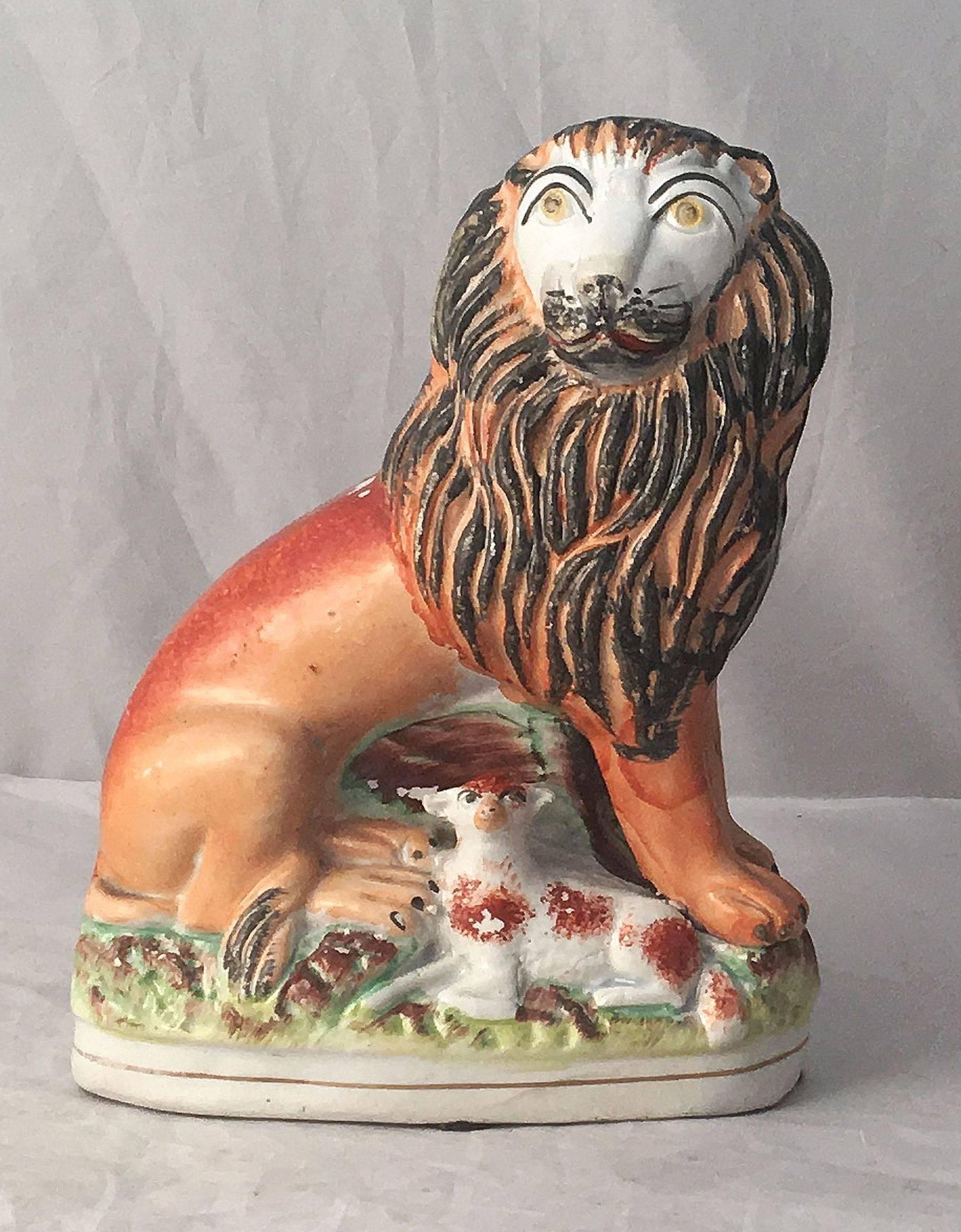 Glazed Pair of 19th Century English Staffordshire Lions with Lambs For Sale