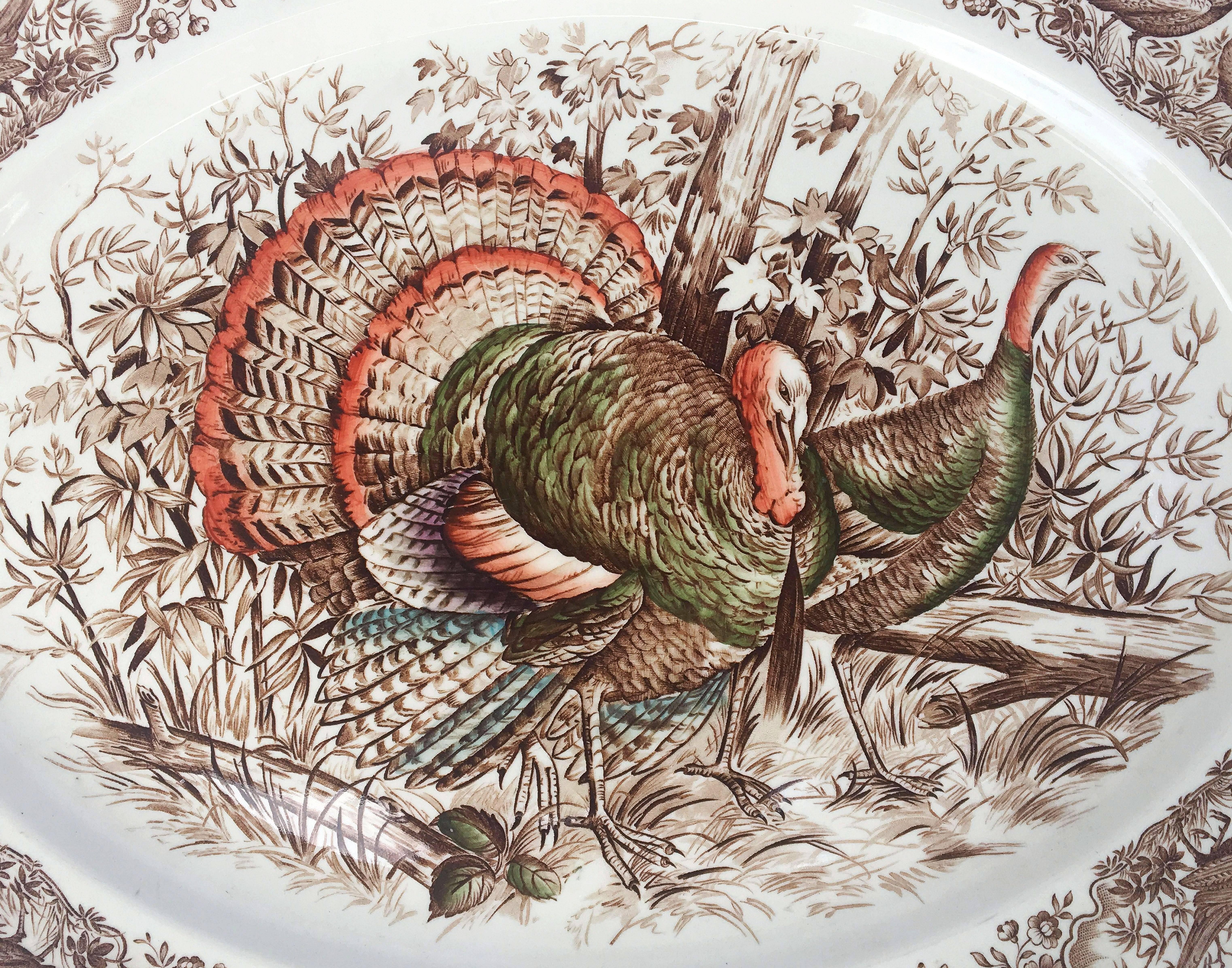 A large vintage serving platter featuring the Wild Turkey, Native American brown and white transfer-ware pattern by the celebrated English pottery firm, Johnson Brothers.

With authentic midcentury brown label on reverse.

Perfect for the