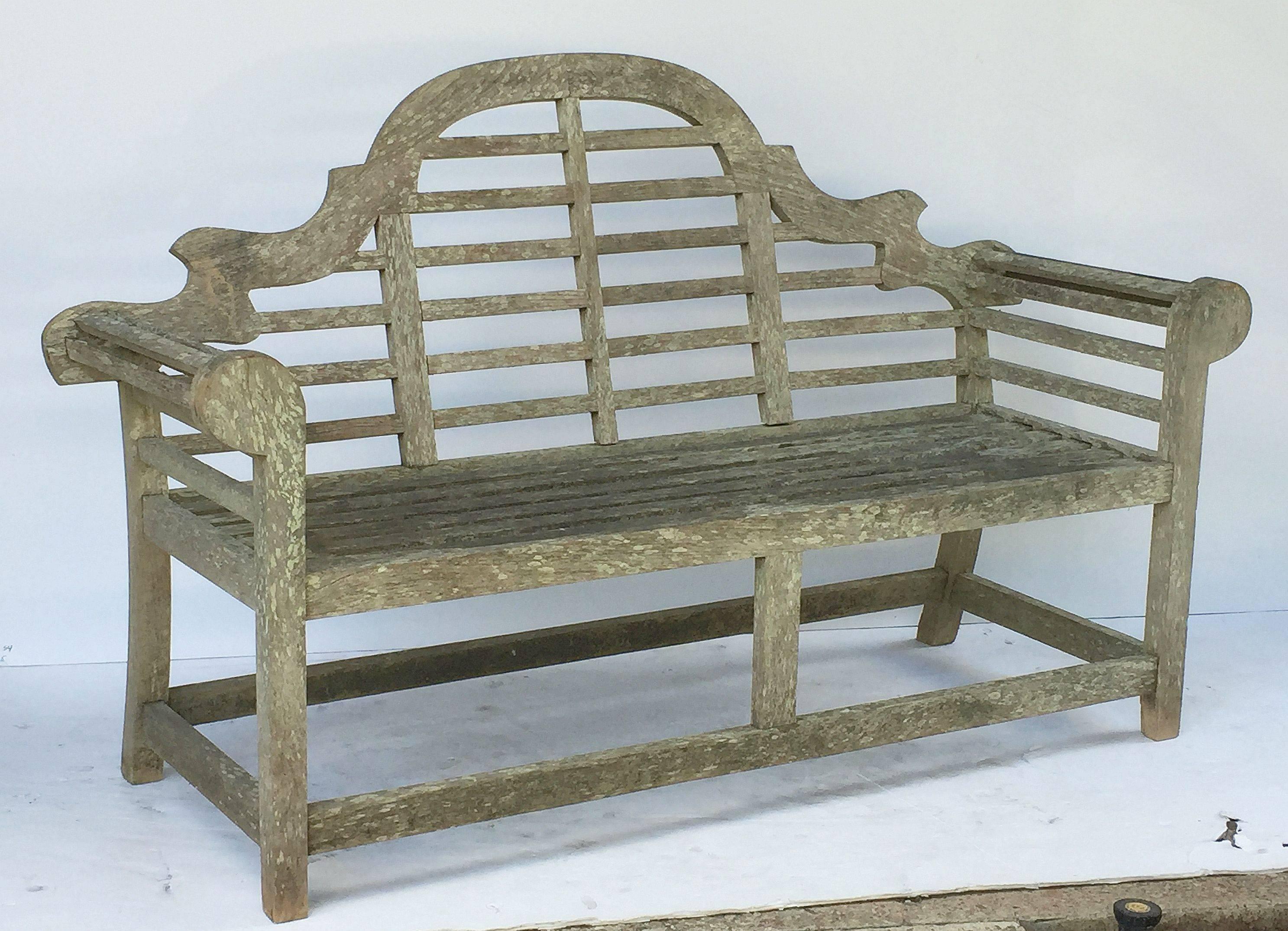 A vintage Lutyens style teak English garden bench after Sir Edwin Lutyens, the British architect renowned for his imaginative, Classic designs throughout England, Ireland and New Delhi (India).

Featuring a high-arched back for comfort and