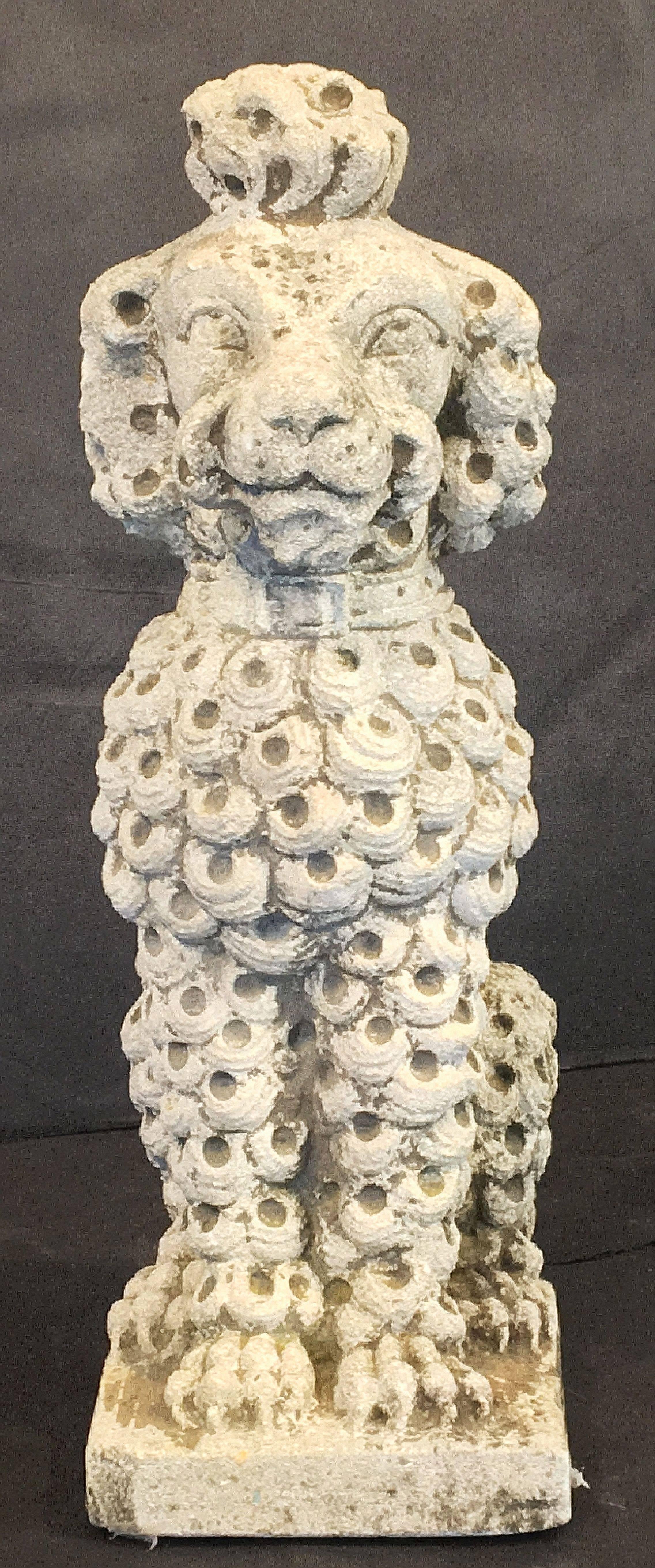 A fine English ornamental garden statuary poodle dog, of composition stone, each featuring finely detailed modeling.

One available - $2895 

Perfect for a garden room or conservatory!