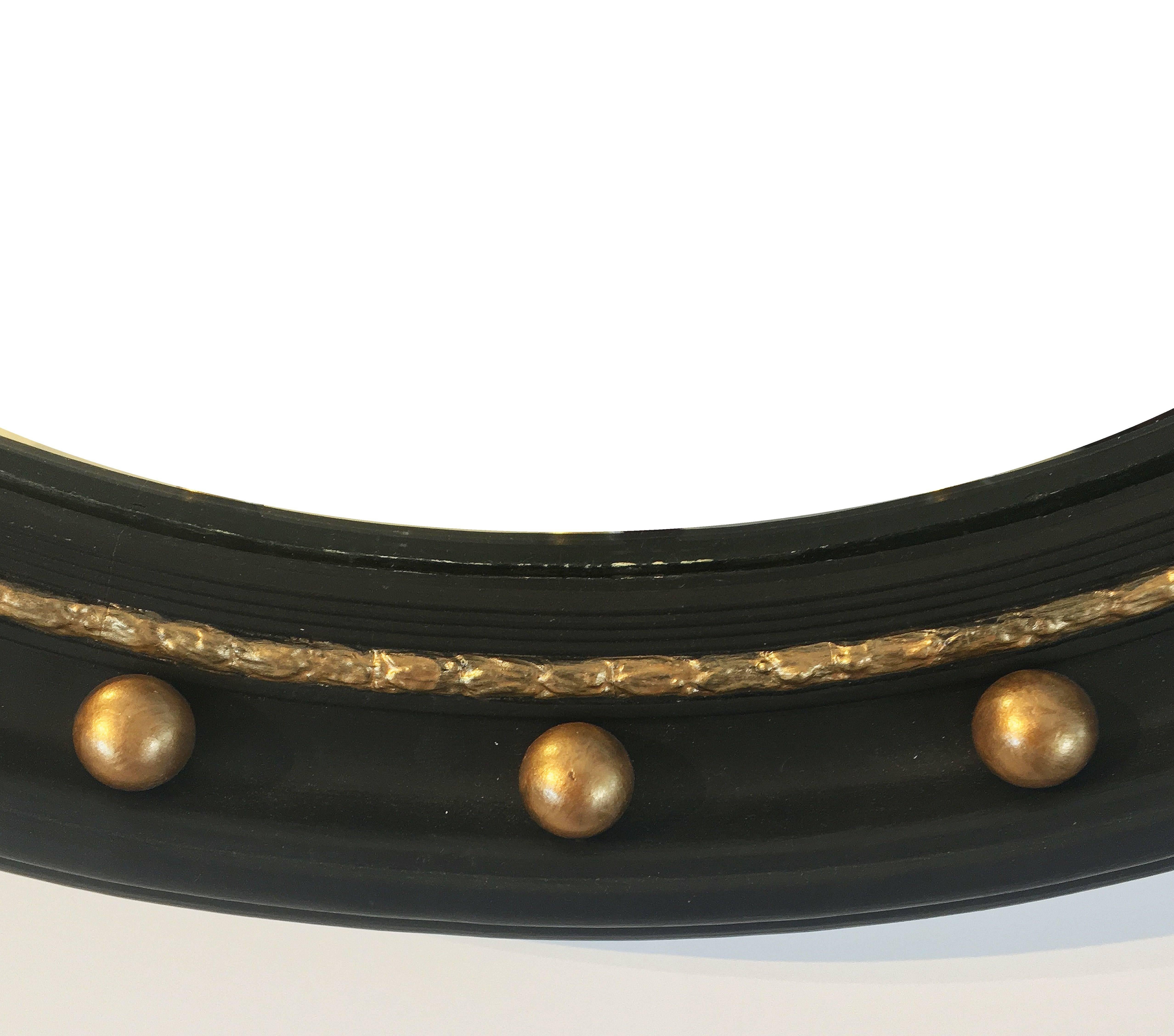 black and gold convex mirror