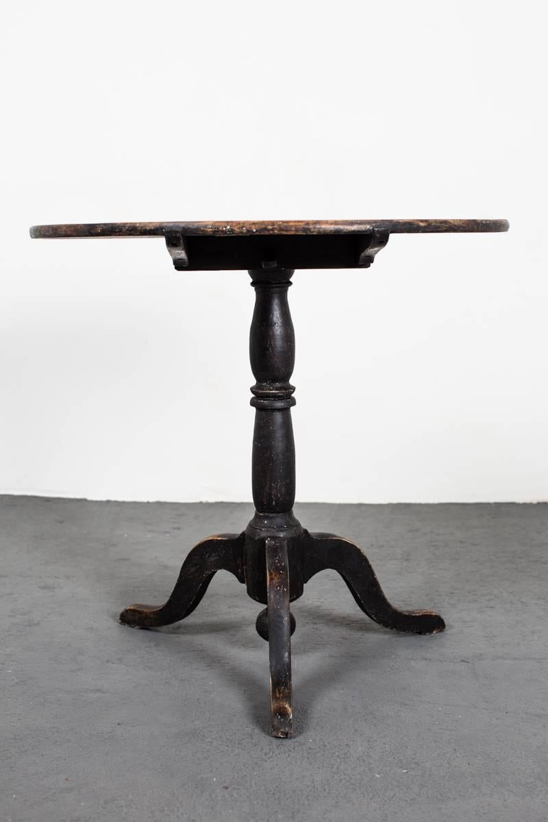 Table Tilt-Top Chess Swedish 19th Century Sweden. A tilt-top table made during the 19th century in Sweden. Round top with a turned base standing on a tripod base. Later paint. Wear consistent with age and use. 

 
