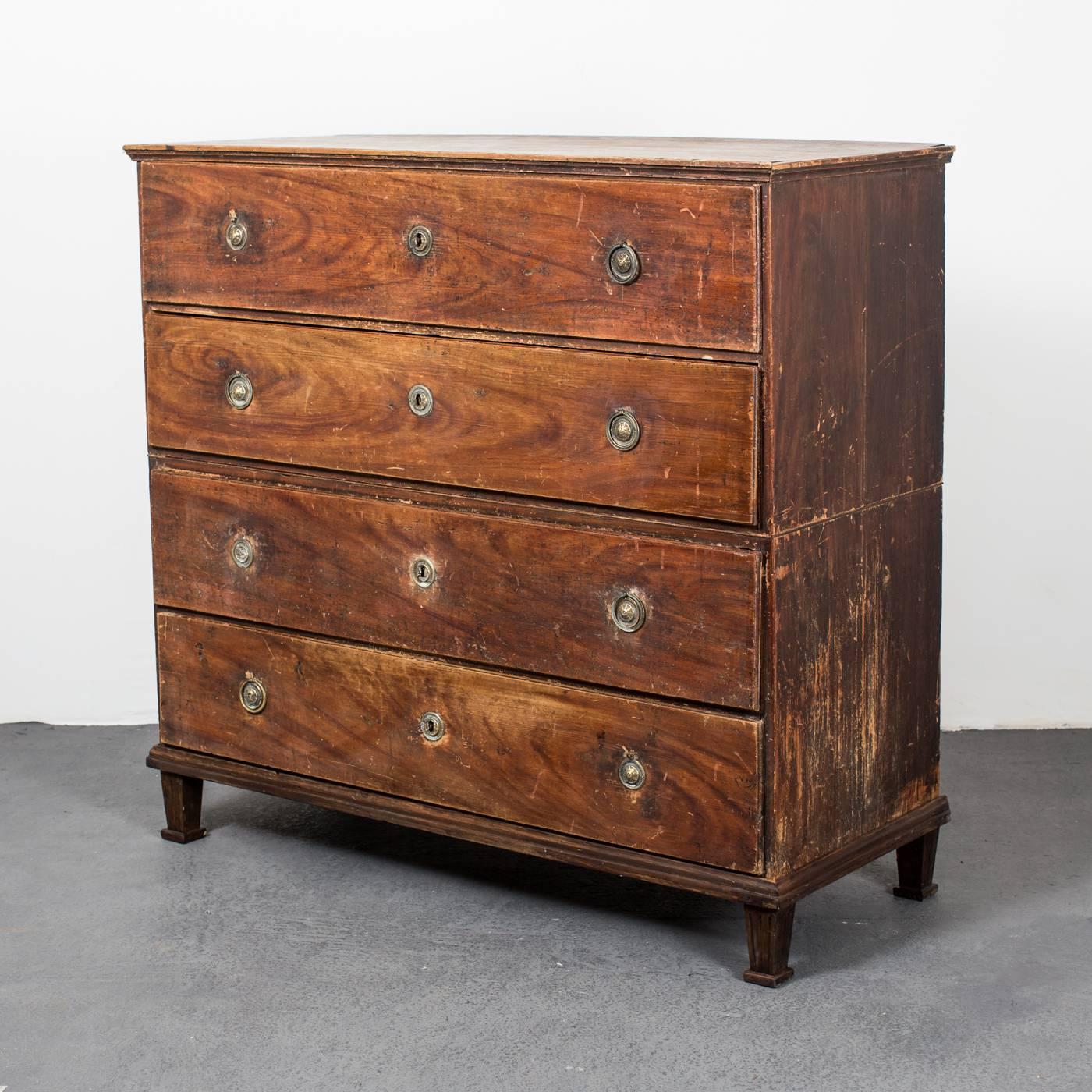 A chest of drawers made during the 18th century and Gustavian in Sweden. Four drawers standing on a frame with four channeled and tapered legs. Original painted finish and brass hardware.
 