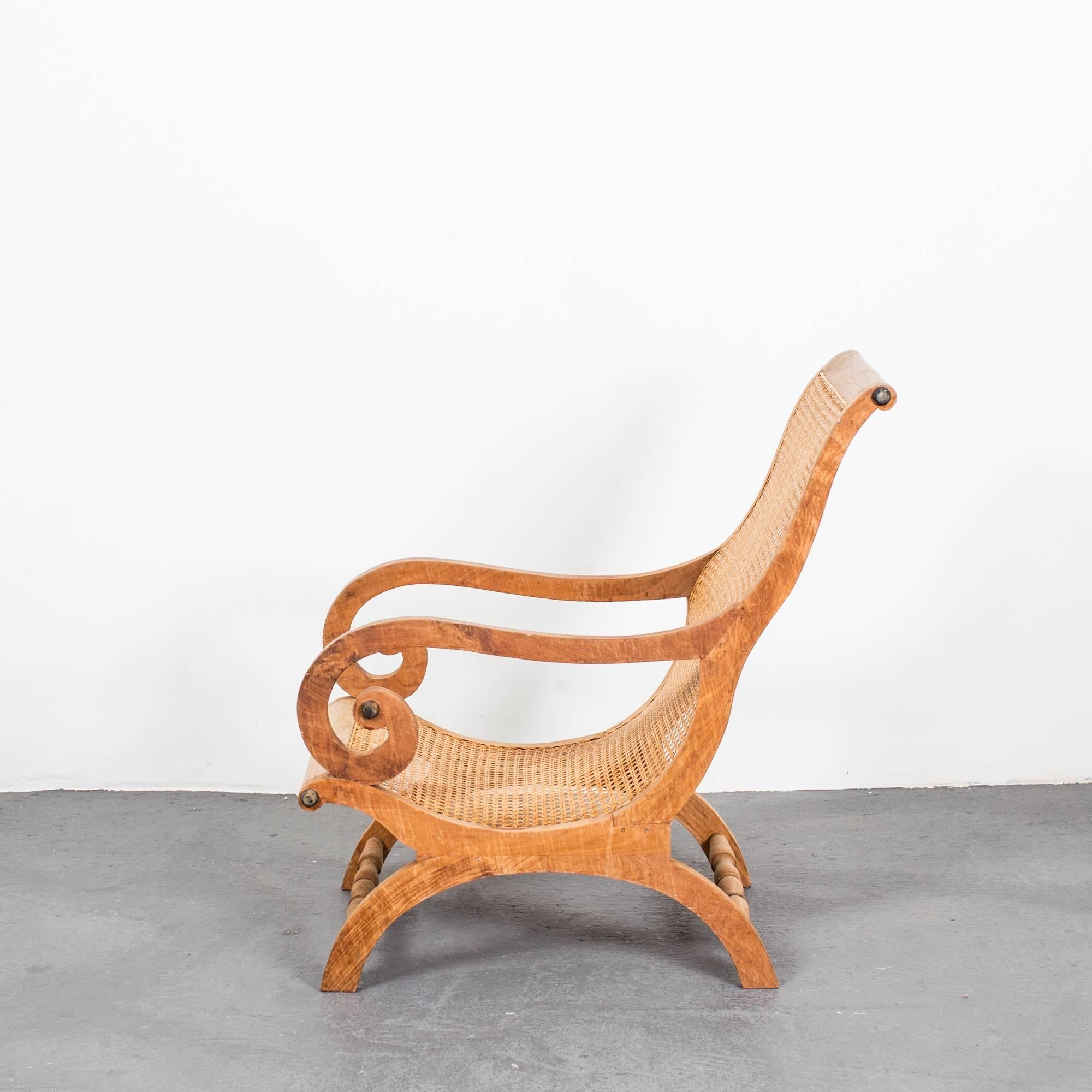 A beautiful but relaxed armchair or lounge chair made during the mid-19th century in Sweden. Frame made from elm and seat from rattan.